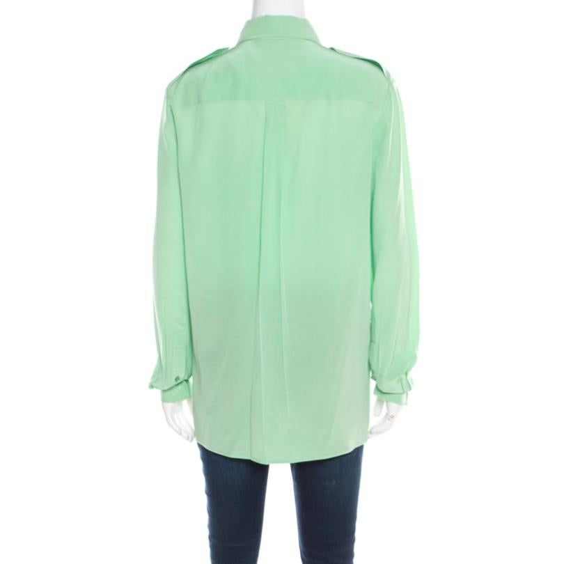 This Chloe blouse is made to last the season, in a pretty green hue. This piece paired with flared trousers will exude your contemporary side. This is crafted in 100% silk and is minimalistic everyday wear essential, perfect for you!

Includes: The