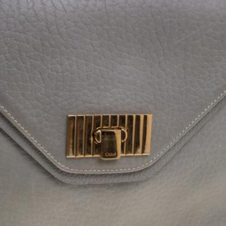 This Sally Flap shoulder bag by Chloe is a piece all fashionistas must look out for! Exquisitely crafted from pebbled leather, it features a chain shoulder strap with a leather band and a flap with a push button closure that opens to a fabric-lined