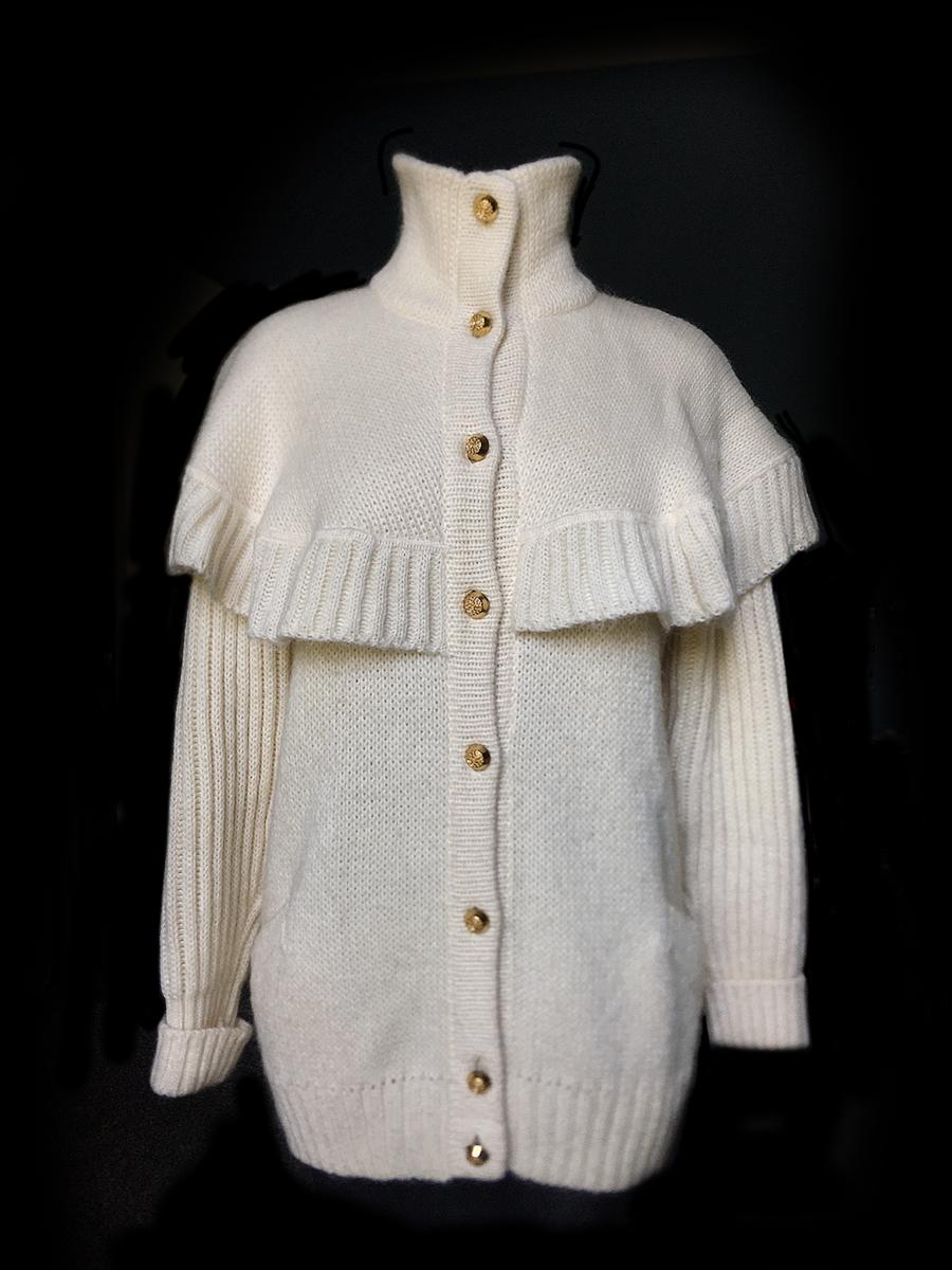 1980’s Chloe: Ivory Heavy hand knit cardigan sweater in excellent condition. Ruffle at bodice and back, Gold tone metal buttons.  Size 42 made in Italy, 50% Mohair 50% Acrylic. Length from back of neck: 28