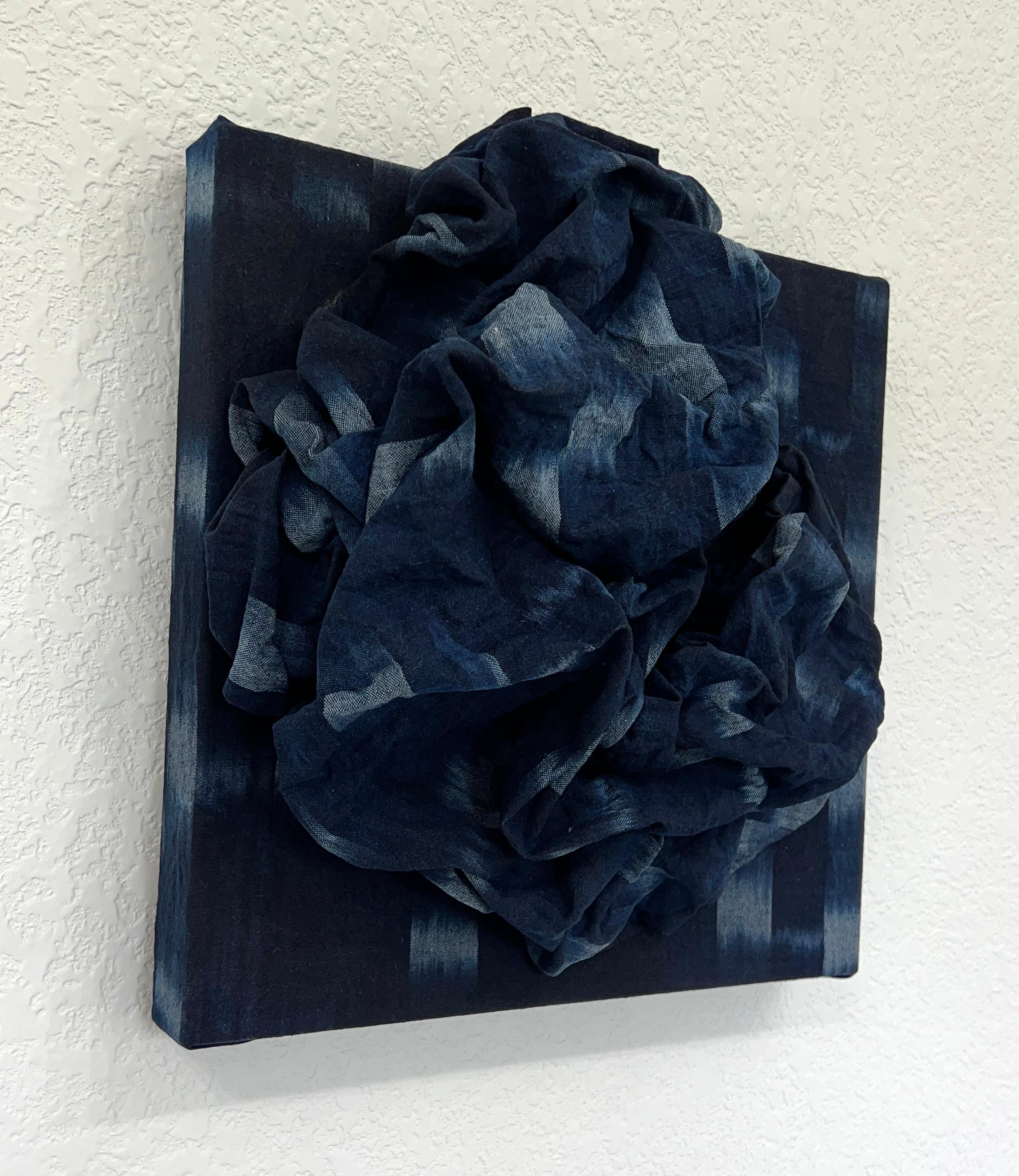 TAKI-KASURI FOLDS from Chloe Hedden’s Fold Series explores the tension between softness and structure through the poetic manipulation of handmade Japanese fabric on linen. In this sculptural textile piece, Hedden employs taki-kasuri—a traditional