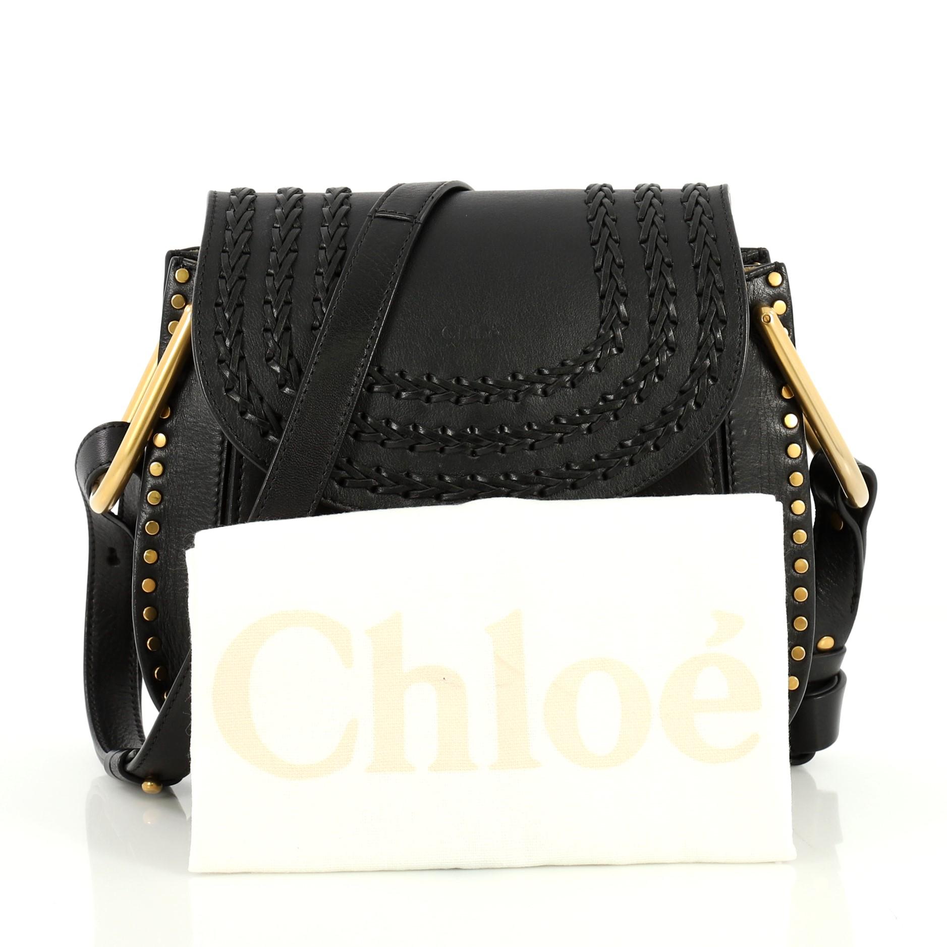 This Chloe Hudson Handbag Whipstitch Leather Medium, crafted from black leather, features an adjustable flat shoulder strap, whipstitched detailing, suede tassel, studded trim, slip pocket under flap and gold-tone hardware. Its flap opens to a