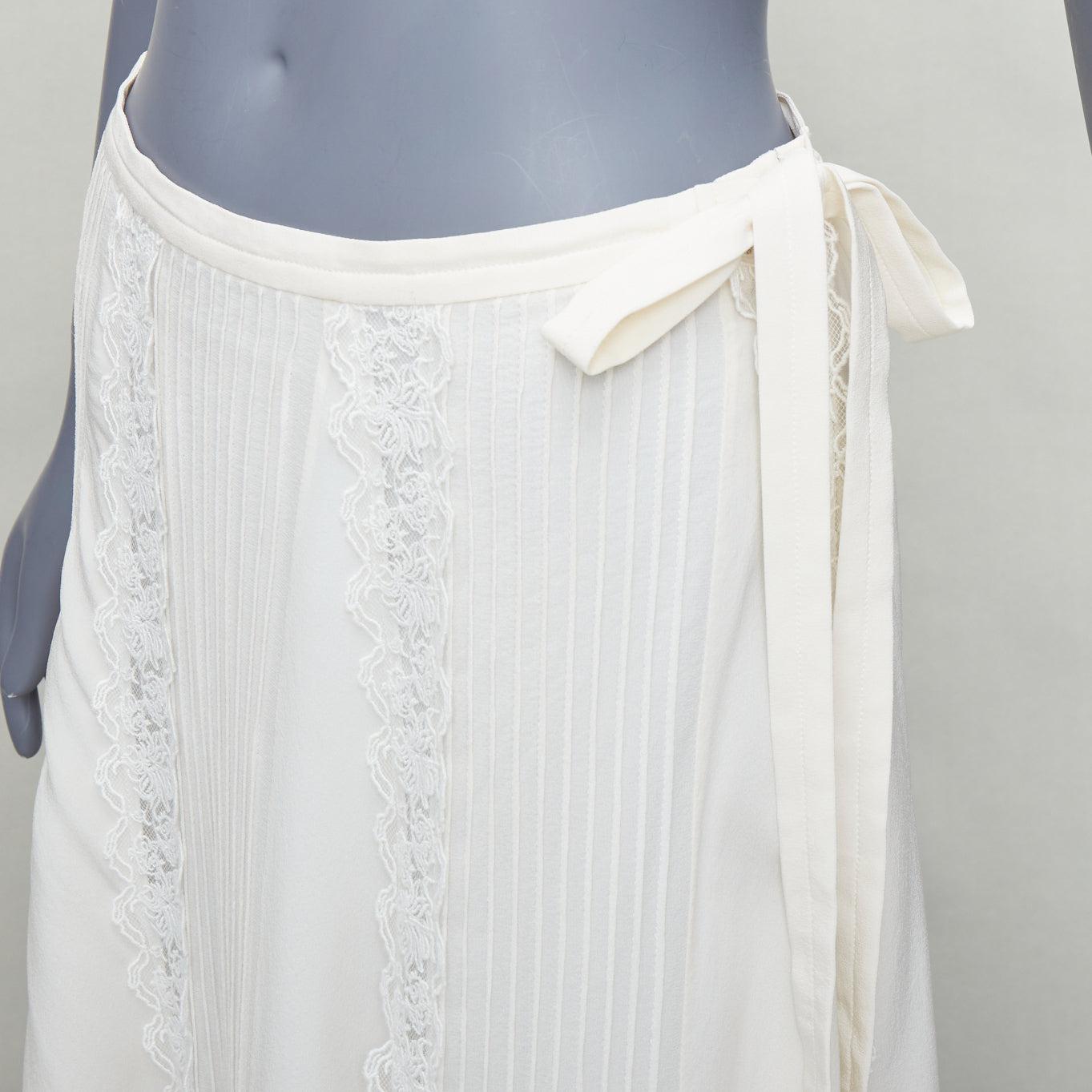 CHLOE Iconic Milk cream 100% silk lace trim pleated midi skirt FR36 S
Reference: KYCG/A00097
Brand: Chloe
Model: Iconic Milk
Material: Silk
Color: Cream
Pattern: Solid
Closure: Zip
Lining: Cream Silk
Extra Details: Zip side.
Made in: