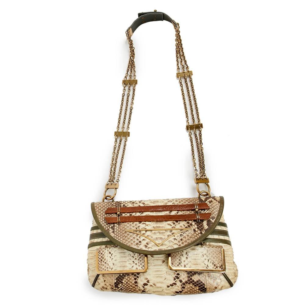 Collector bag !!! This beautiful Bag can be shoulder or crossbody. It s made of natural python. 
 The jewelry is in metal gold toned color. In very good condition with signs of wear inside (see pictures). The bag has 2 small pockets in front and one