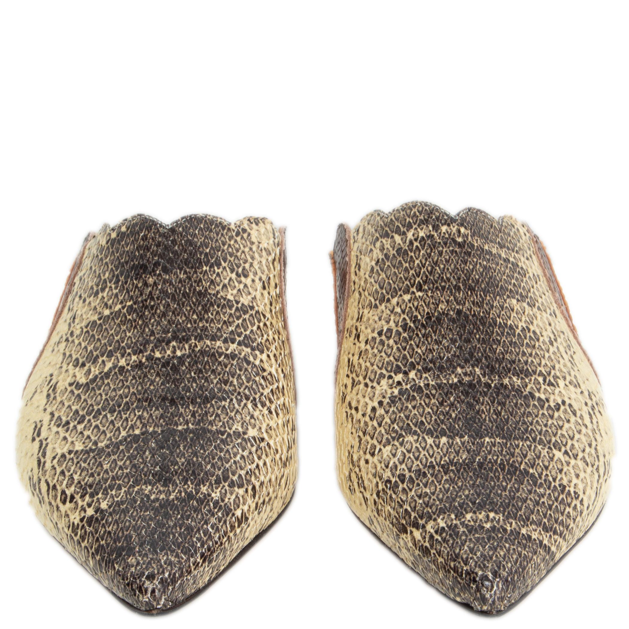 100% authentic Chloé Lauren mules with oversized scallops in vanilla, black, brown and cognac snake printed calfskin. Brand new. Come with dust bag. 

Measurements
Imprinted Size	37
Shoe Size	37
Inside Sole	24cm (9.4in)
Width	7.5cm (2.9in)
Heel	1cm