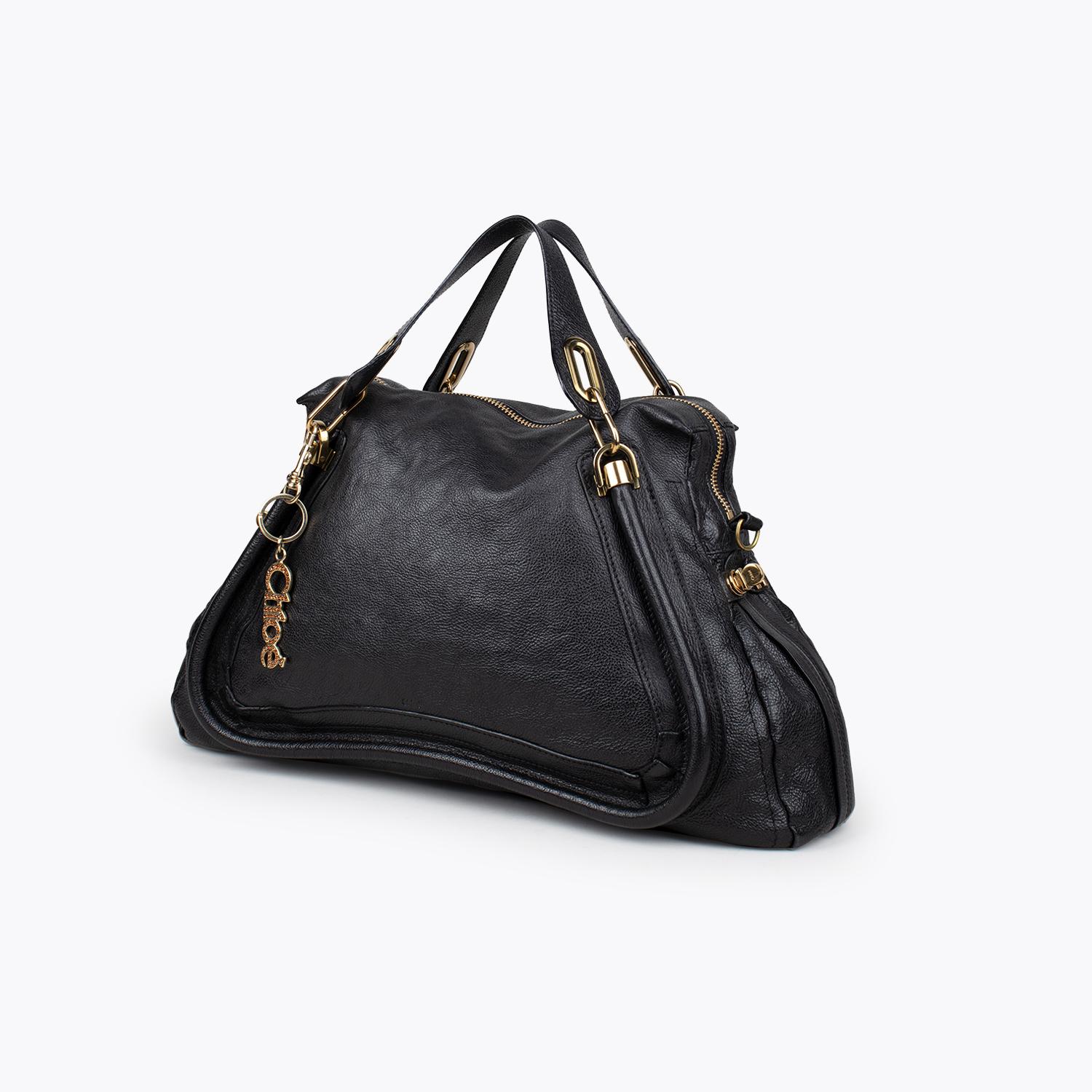 Black grained leather Chloé Large Paraty satchel with

- Gold-tone hardware
- Dual flat top handles
- Single optional rolled shoulder strap
- Tonal woven lining, dual pockets at interior walls; one with zip closure and zip closure at top

Overall