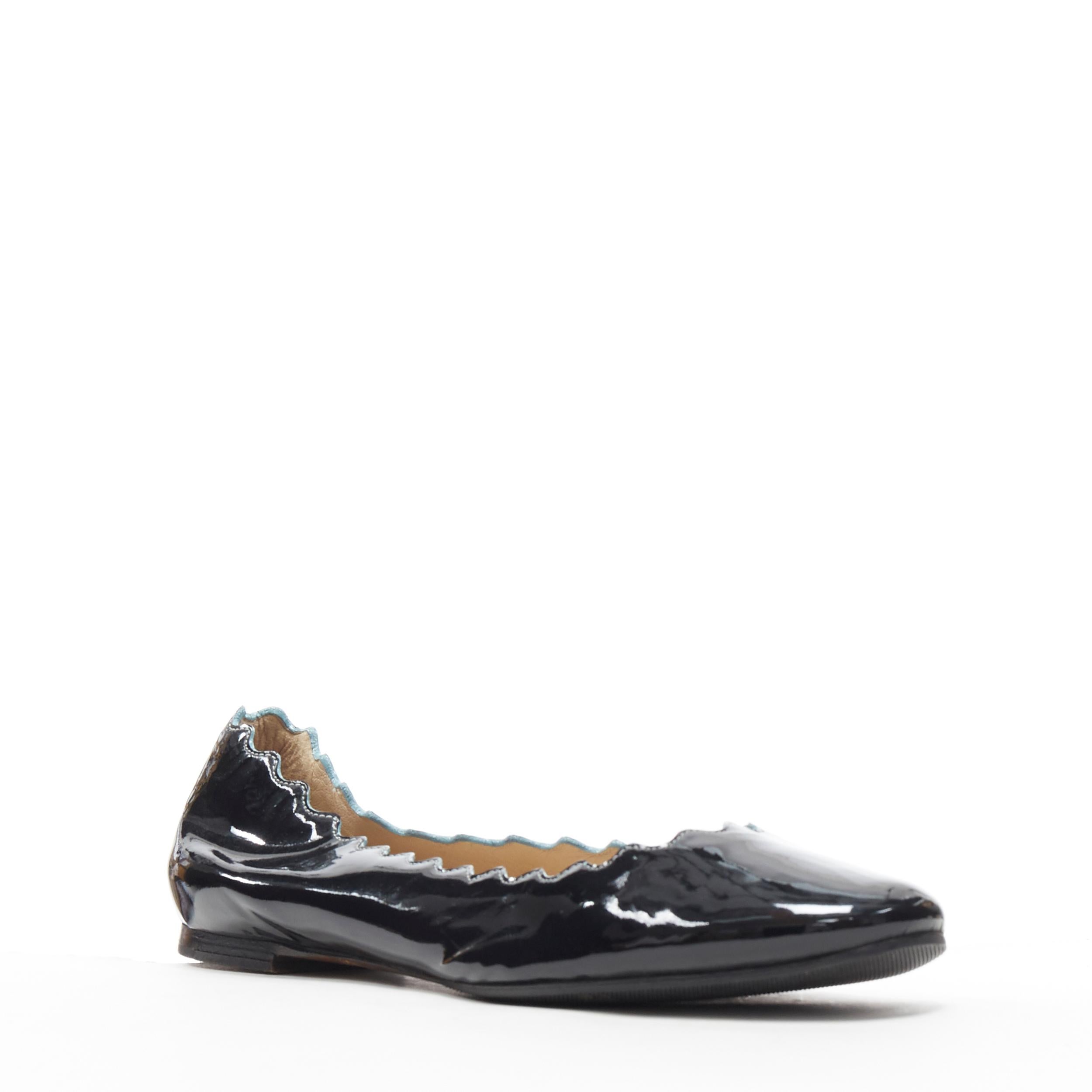 CHLOE Lauren  black patent leather scalloped edge round toe ballet flats EU35
Brand: Chloe
Model Name / Style: Lauren
Material: Patent leather
Color: Black
Pattern: Solid
Extra Detail: Light blue painted edges along scalloped seams. Flat (Under 1