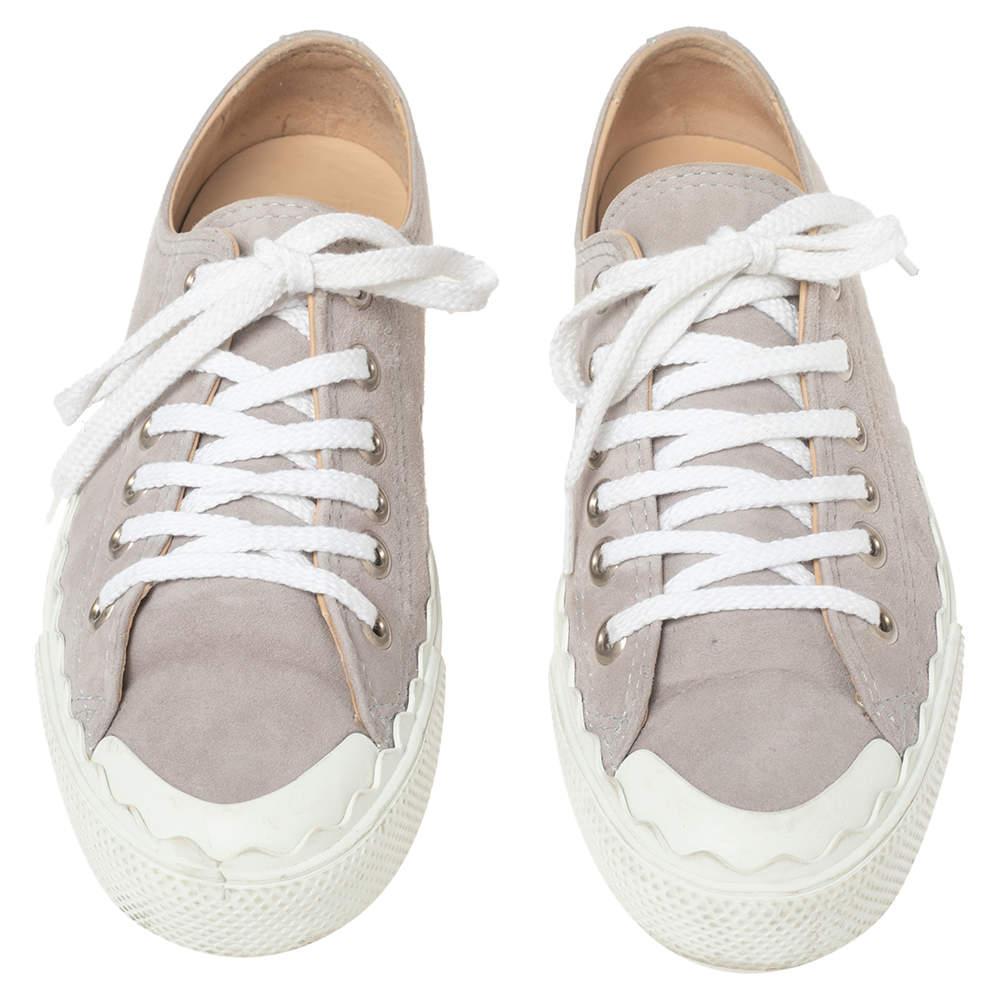These sneakers are from Chloé's 'Lauren' range of designs. Crafted using suede, the sneakers are secured with laces and set atop rubber soles. The scalloped detailing around the shoes is a signature of the line.

