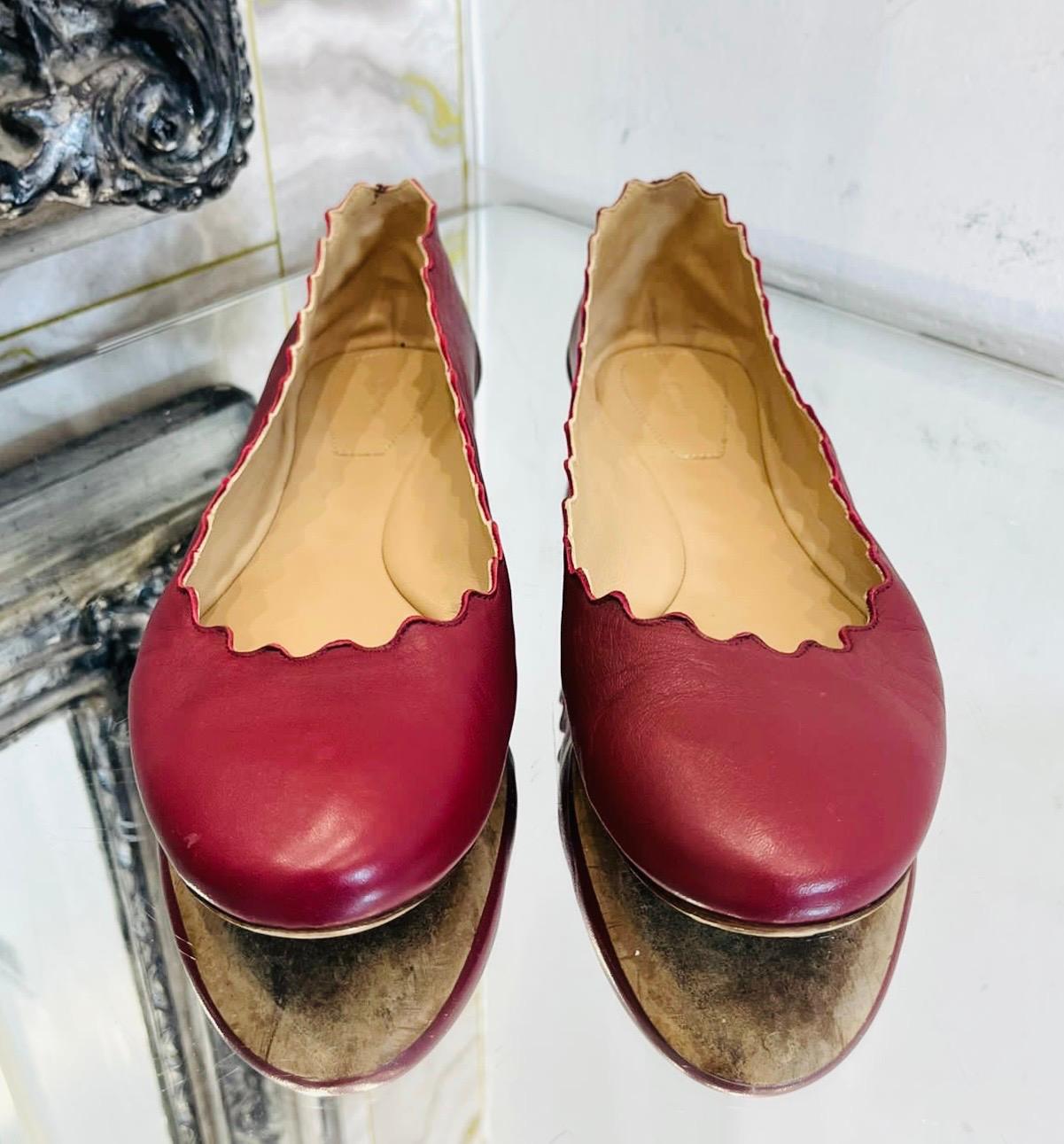 Chloe Leather Ballerina Flats

Burgundy 'Lauren' ballerinas designed with scalloped trim.

Featuring almond toe, short heel and leather insoles and soles. Rrp £420

Size – 37

Condition – Very Good (Small signs of wear, not visible while