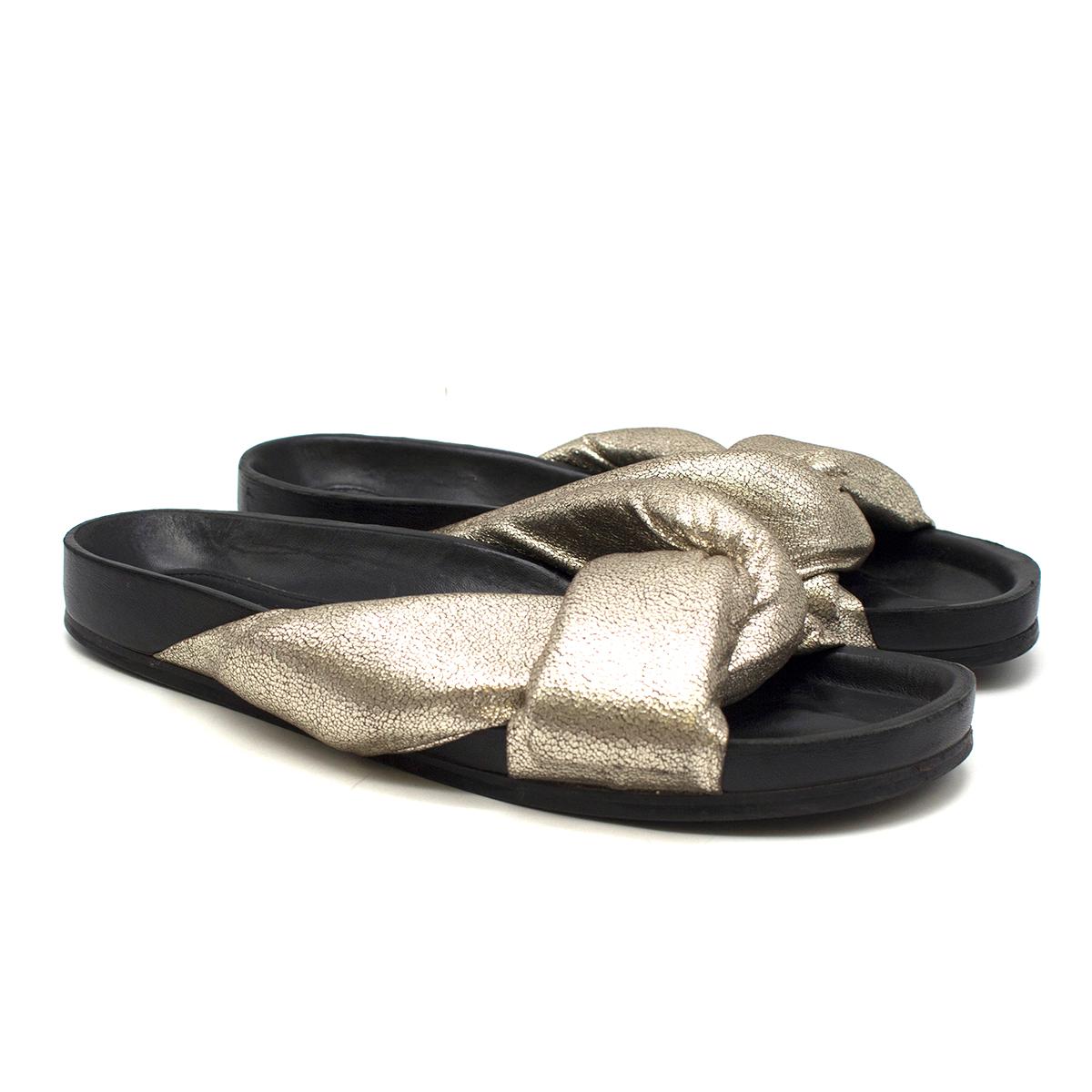Chloe Leather Crisscross Slide Sandals

- Metallic Crackled Gold Leather Crisscross Slide Sandals
- Crisscross vamp
- Open toe
- Slide-on style
- Molded footbed
- Black leather lining with logo embroidered
- Rubber outsole

Please note, these items