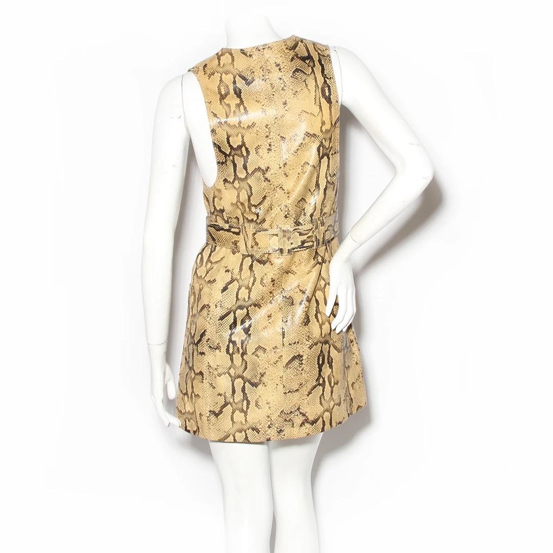 Snake-Effect Leather Dress by Chloe 
Tan and black snakeskin-printed leather 
Buttons down front 
Belted at waist
Dual oversized front pockets
100% leather with 100% cotton lining 
Excellent condition; No visible signs of wear or use.