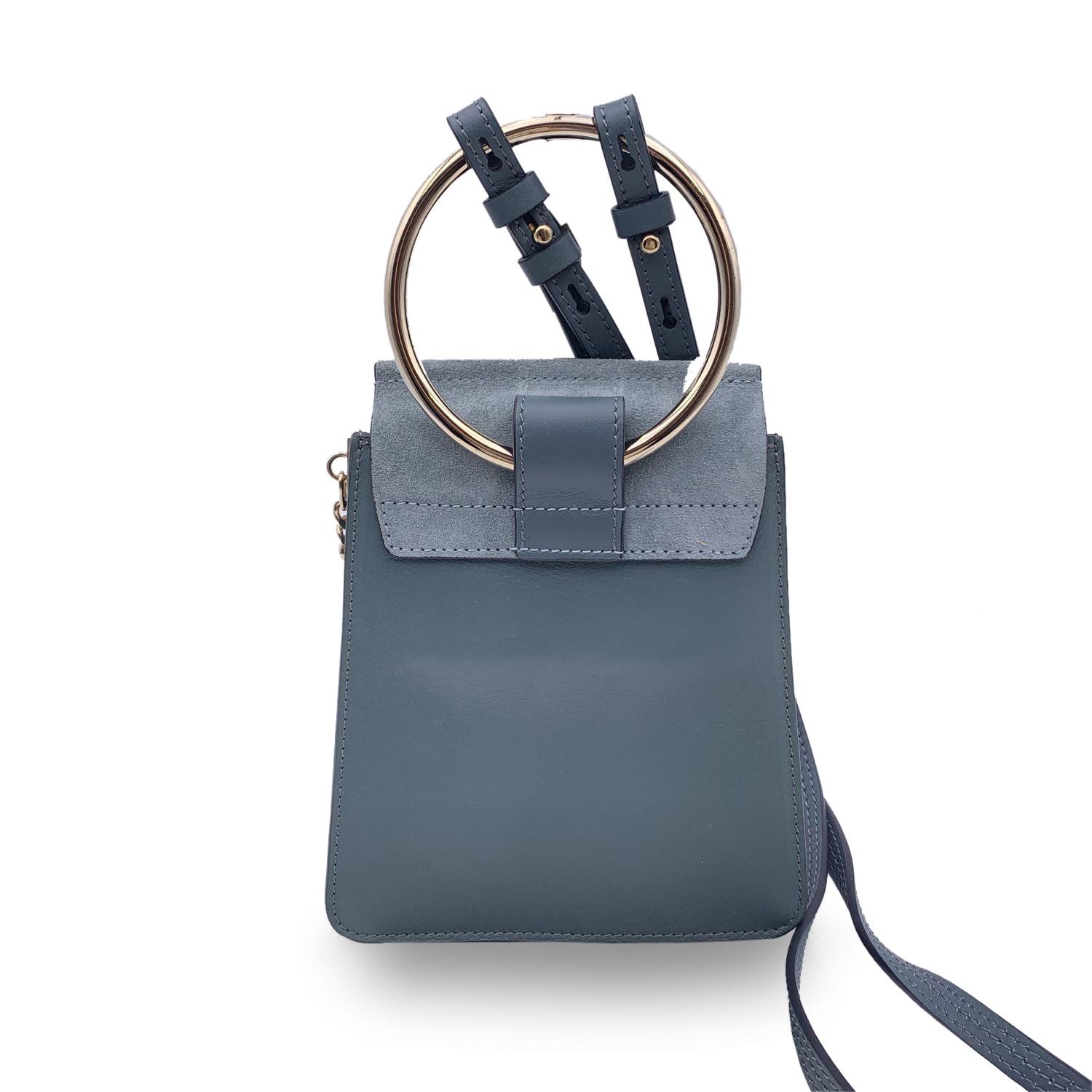 This beautiful Bag will come with a Certificate of Authenticity provided by Entrupy. The certificate will be provided at no further cost. Chloé Faye shoulder bag in light blue suede and leather. The Faye was created for the 2015 spring/summer
