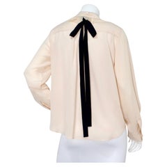 Chloe Light Pinky Beige Ruffled Collar Silk Blouse With Black Bow Detail