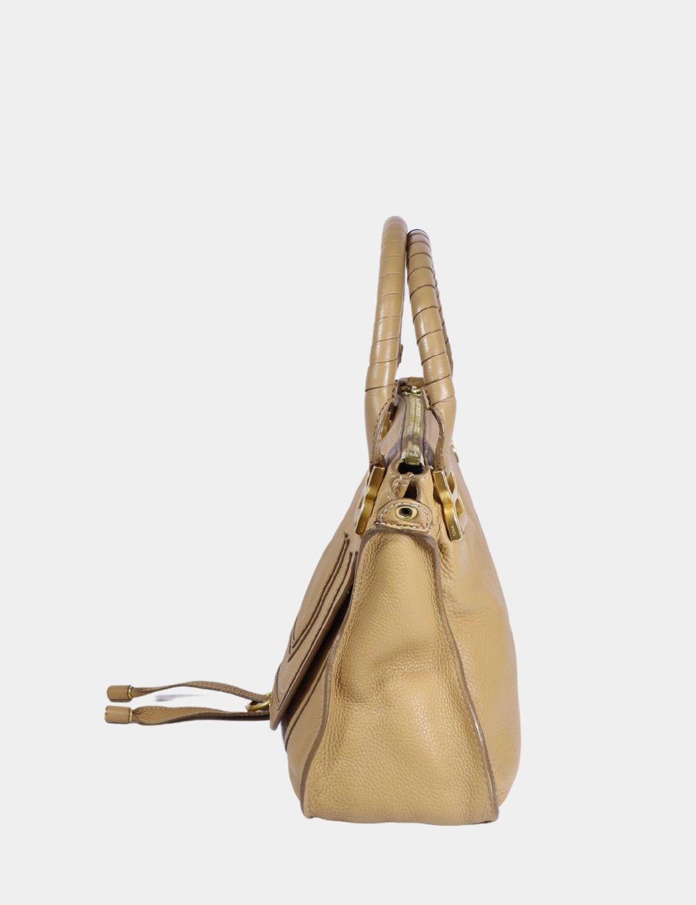 Chloe Marcie Beige Bag. Features a zippered closure, front slip pocket hidden by the flap, two handle straps, and a removable leather strap attached with hooks.

Material: Leather
Hardware: Gold
Height: 28cm
Width: 34cm
Depth: 11cm
Shoulder Strap: