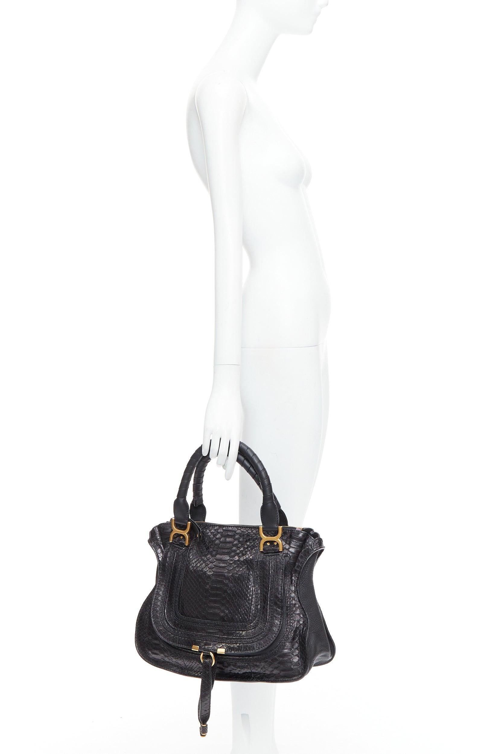 CHLOE Marcie black scaled leather gold hardware satchel bag
Reference: TGAS/E00497
Brand: Chloe
Model: Marcie
Material: Leather
Color: Black, Gold
Pattern: Animal Print
Closure: Zip
Lining: Beige Fabric
Extra Details: The Marcie features a python
