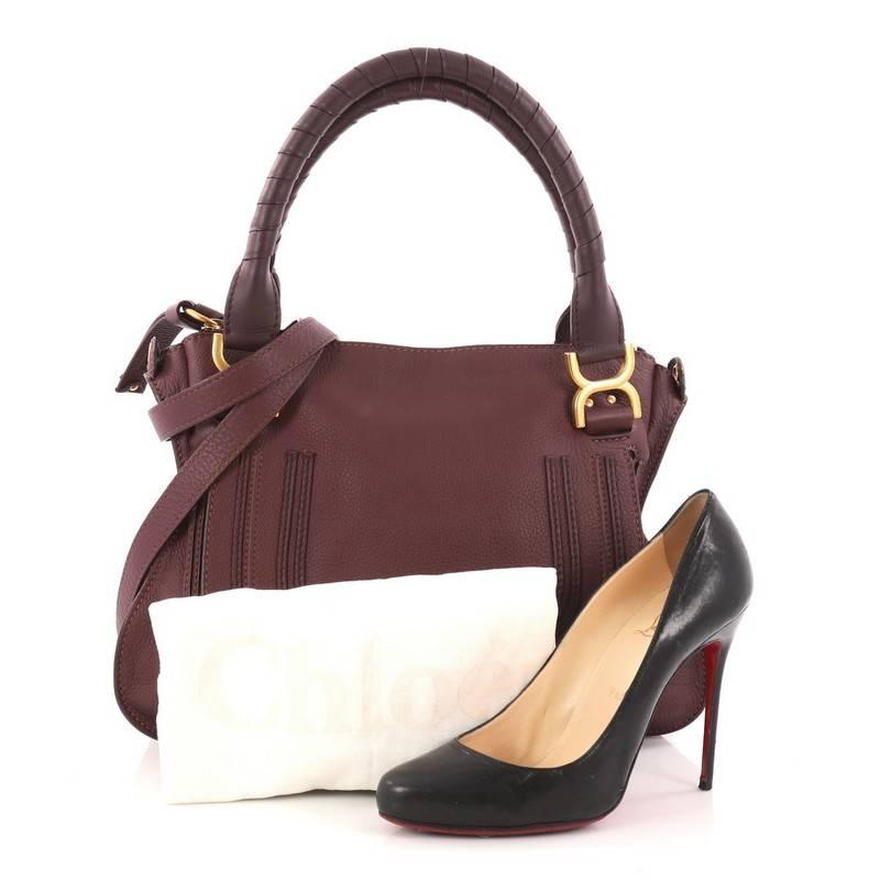 This authentic Chloe Marcie Satchel Leather Medium is perfect for the on-the-go fashionista. Constructed from plum leather, this popular satchel features wrapped leather handles, horseshoe stitched front flap, and gold-tone hardware. Its top zipped