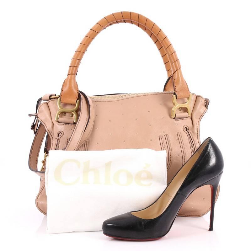 This authentic Chloe Marcie Satchel Studded Leather Medium showcases the brand's popular horseshoe design in a classic hobo silhouette. Constructed from pink leather, this functional yet stylish satchel features a slouchy easy-to-carry silhouette,