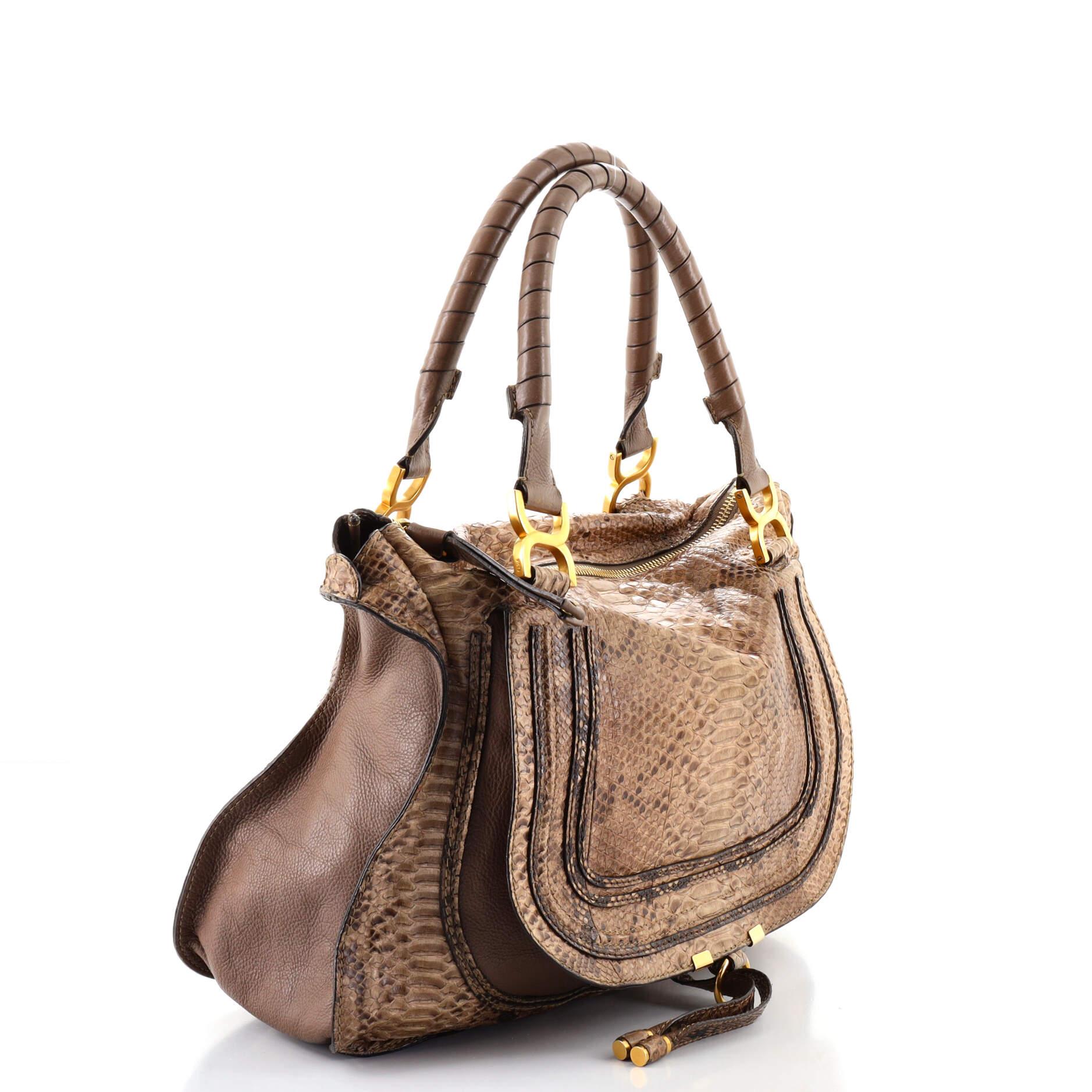 Condition: Good. Odor in interior. Creasing and minor lifting of scales on exterior, cracking and splitting on handle base, exterior and zipper pull wax edges, creasing and marks on handle bases. Wear in interior, scratches and tarnish on