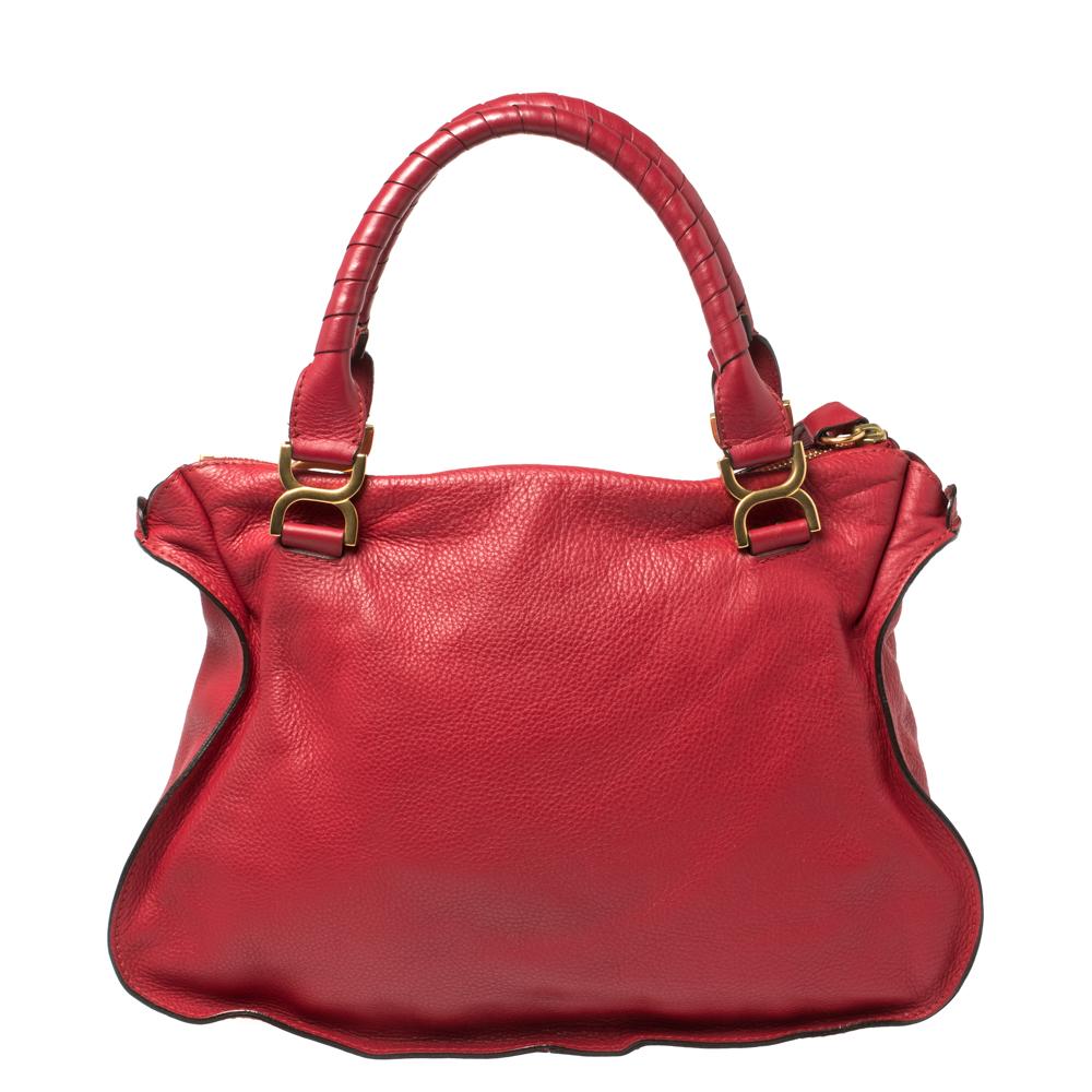 Stunning to look at and durable enough to accompany you wherever you go, this Chloe satchel is a joy to own! This Marcie bag is crafted from maroon-hued leather with dual handles and a well-designed front exterior enhanced with stitch detailings and
