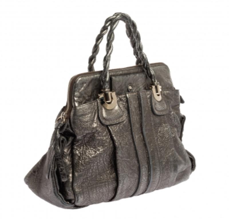 Coveted by fashionable women around the world, the Heloise is a bag worth the price. It is from the luxury brand, Chloe. The bag is crafted from metallic textured-leather and designed with braided handles, silver-tone hardware, and a spacious canvas