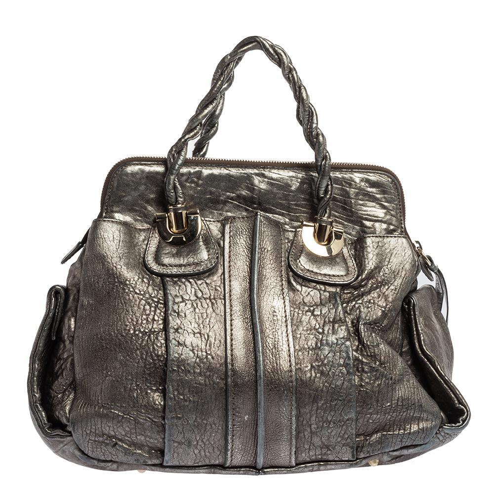 Coveted by fashionable women around the world, the Heloise is a bag worth the price. It is from the luxury brand, Chloe. The bag is crafted from metallic textured-leather and designed with braided handles, silver-tone hardware, and a spacious canvas