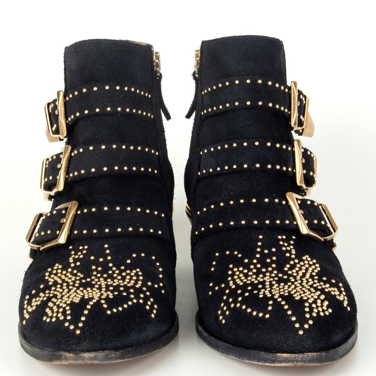 100% authentic Chloé 'Susanna' biker booties in midnight blue suede featuring gold-tone studds and three buckles on the side. Open with a zipper on the inside. Have been worn and are in excellent condition. 

Measurements
Imprinted Size	38
Shoe