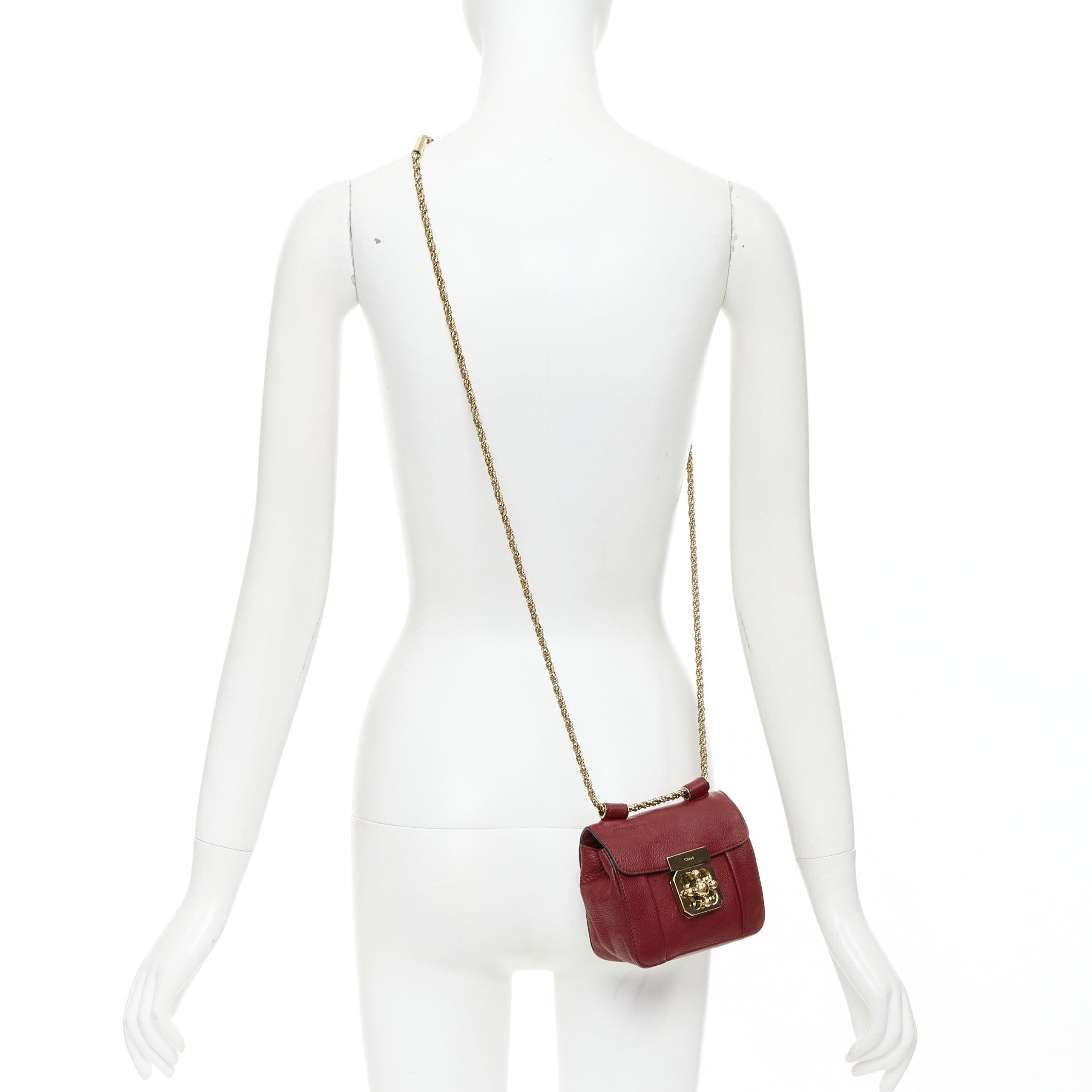 CHLOE Mini Elsie burgundy leather gold turnlock mini crossbody bag
Reference: ECLO/A00176
Brand: Chloe
Model: Elsie
Material: Leather
Color: Burgundy, Gold
Pattern: Solid
Closure: Turnlock
Lining: Nude Leather
Extra Details: Chlo√© Elsie Mini Chain