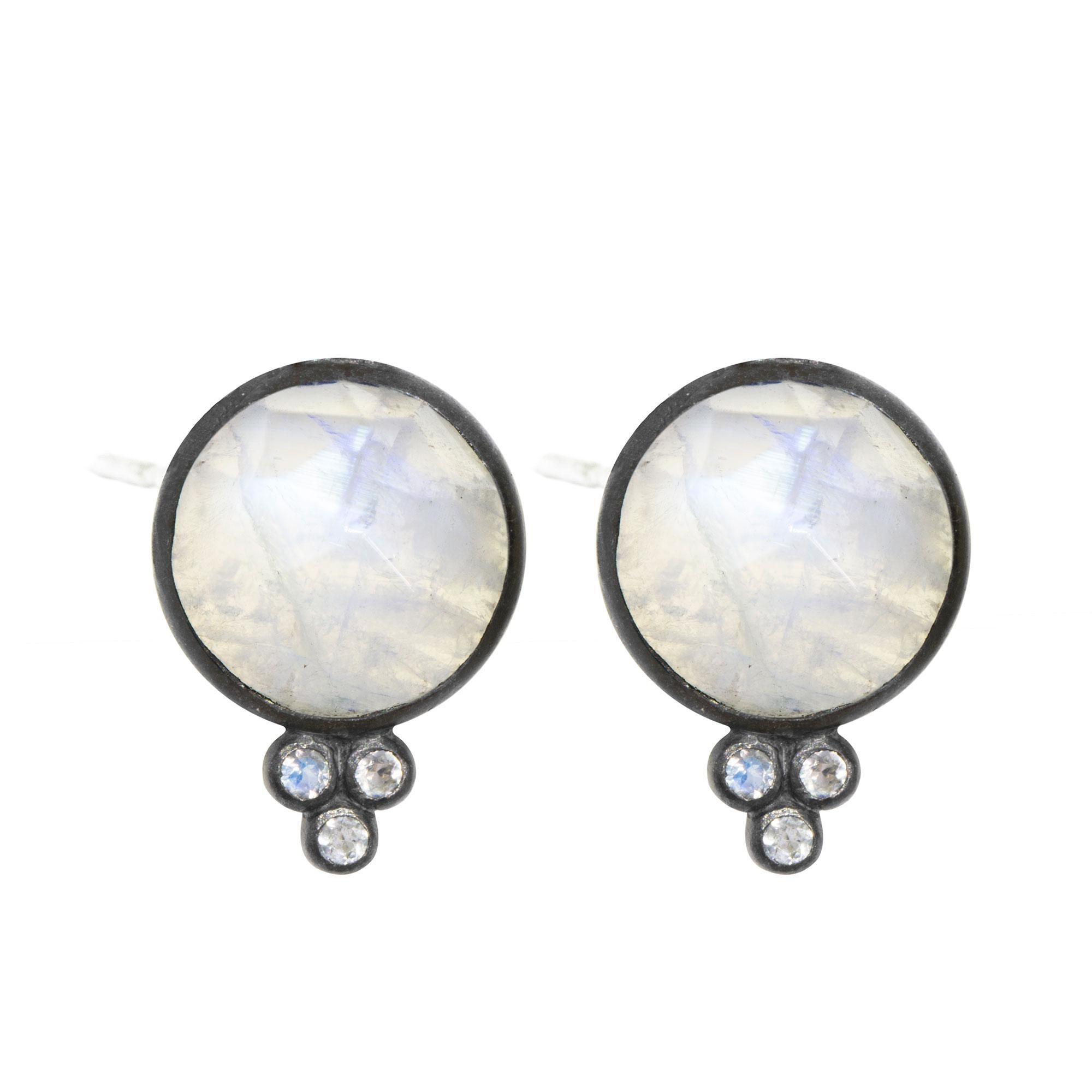 A Nina Nguyen classic: Our Chloe Oxidized Studs are designed with faceted moonstones rimmed in oxidized, and accented with gemstones for some extra sparkle.

Stone carat: 7.3
Stone size: 10mm

About the stones:
Moonstone
Formed by alternating layers