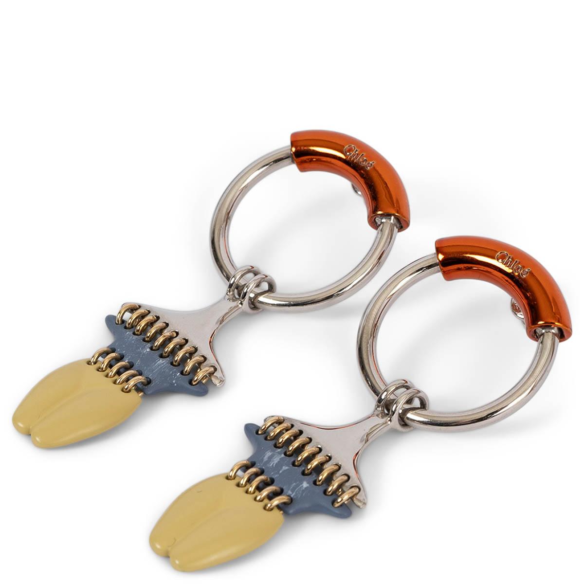 100% authentic Chloé Femininities dangle hoop earring female body shape in silver-tone and orange brass with blue and yellow enamel. Have been worn once and are in virtually new condition. 


Measurements
Width	2.5cm (1in)
Length	6cm