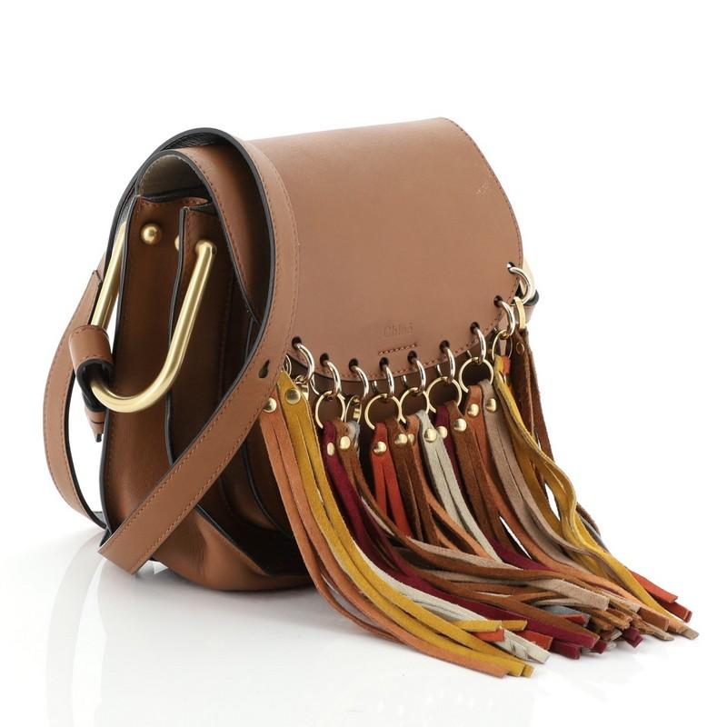 This Chloe Multicolor Fringe Hudson Bag Leather Small, crafted from brown leather, features an adjustable long flat shoulder strap with oversized link ring on its side, multicolor cascading fringe tassels, and matte gold-tone hardware. Its magnetic