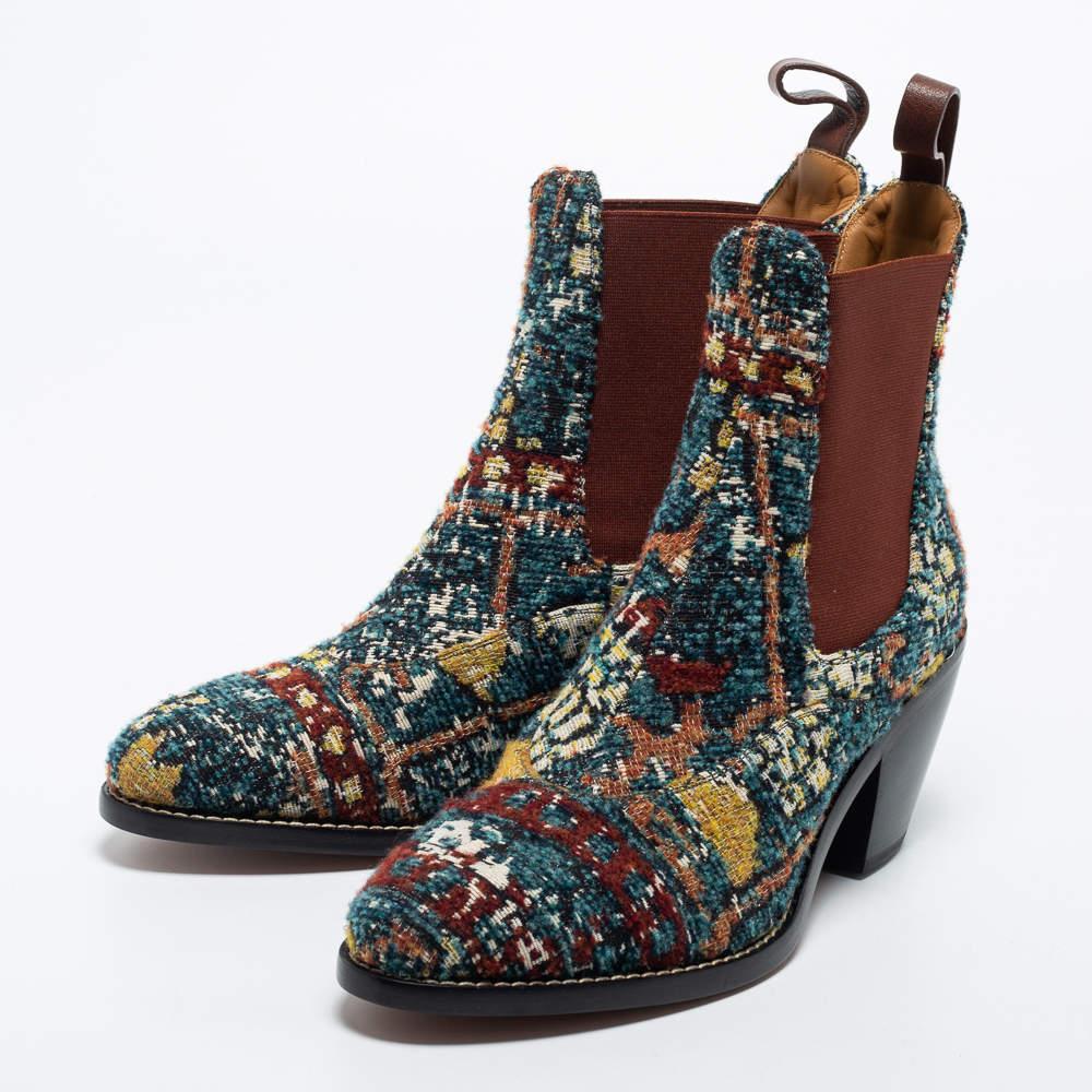 These Chelsea boots from the House of Chloe are super stylish and will definitely incorporate a luxe element into your attire. They are crafted using multicolored tweed into an ankle-length silhouette. Update your shoe collection with these boots.

