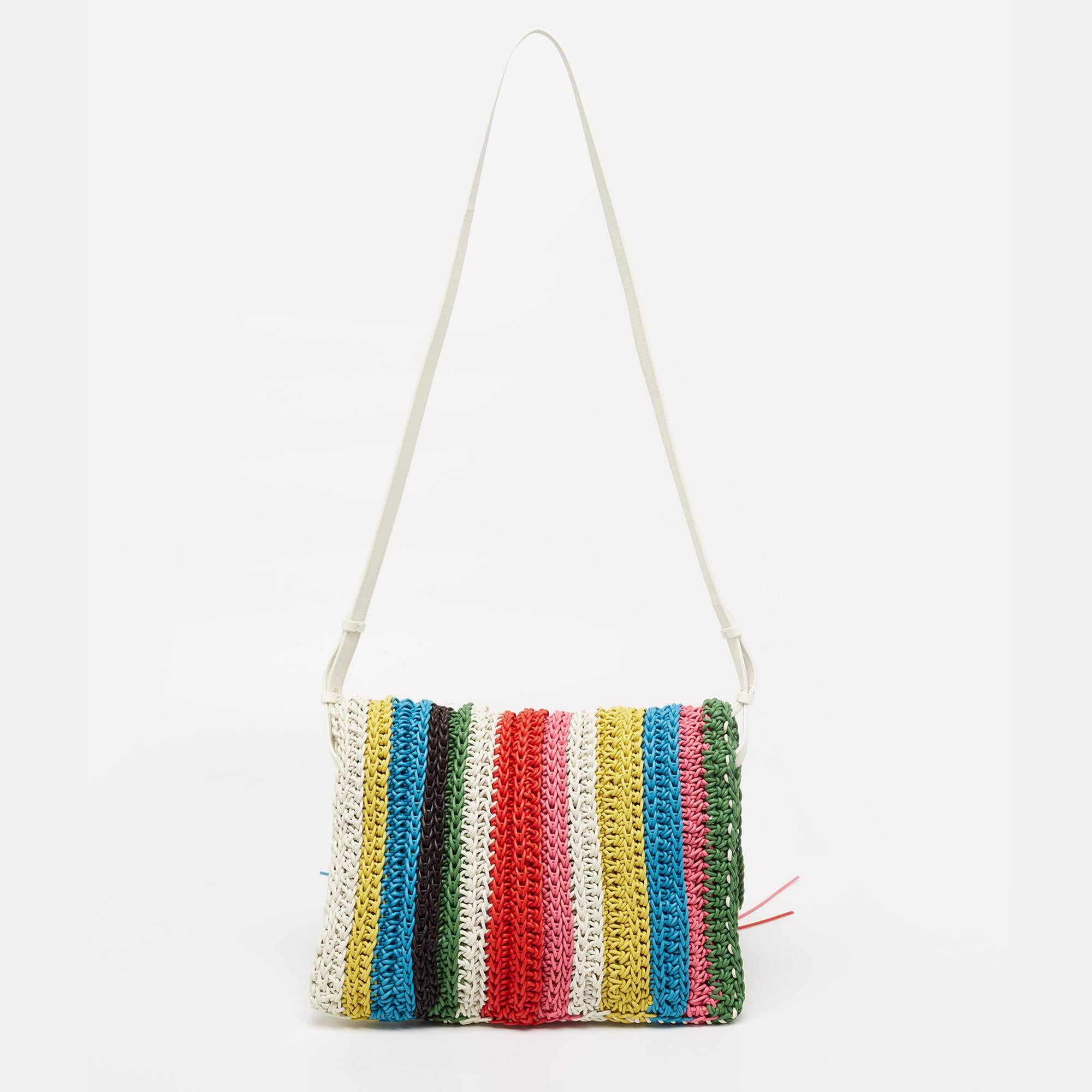 Your perfect summer bag from Chloe is here! Take it to the beach or have a day out with it. Made using leather in the macramé technique, the exterior has multiple vivid hues. The flap has fringes for a playful look.

Includes: Authenticity Card,