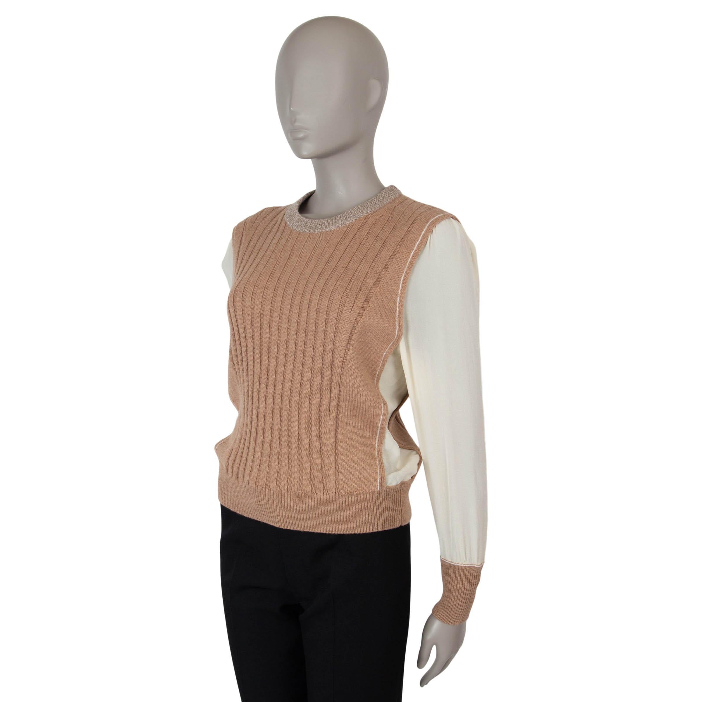 This 100% authentic Chloé crewneck rib knit sweater is a sophisticated blend of textures and design. Crafted from muted brown wool (100%) for a cozy and luxurious feel, it features sheer cream silk (100%) panels along the sides and sleeves, adding a