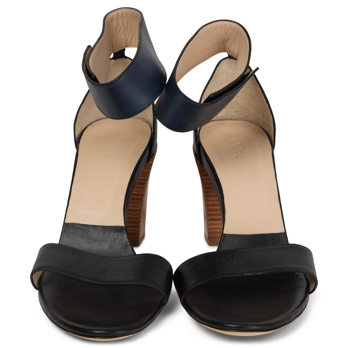 100% authentic Chloé two-tone ankle-strap sandals in seawater (navy blue) and black leather. Opens with a velcro ankle strap. Brand new. 

Measurements
Imprinted Size	42
Shoe Size	42
Inside Sole	27.5cm (10.7in)
Width	8.5cm (3.3in)
Heel	8.5cm