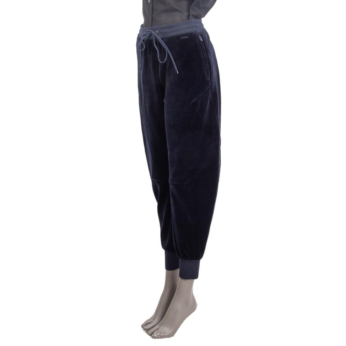 100% authentic Chloé velvet sweat pants in navy blue cotton (80%) and polyester (20%) with zipper pocket and an elastic drawstring waist. Lined in cotton (100%). Have been worn and are in excellent condition. 

Measurements
Tag