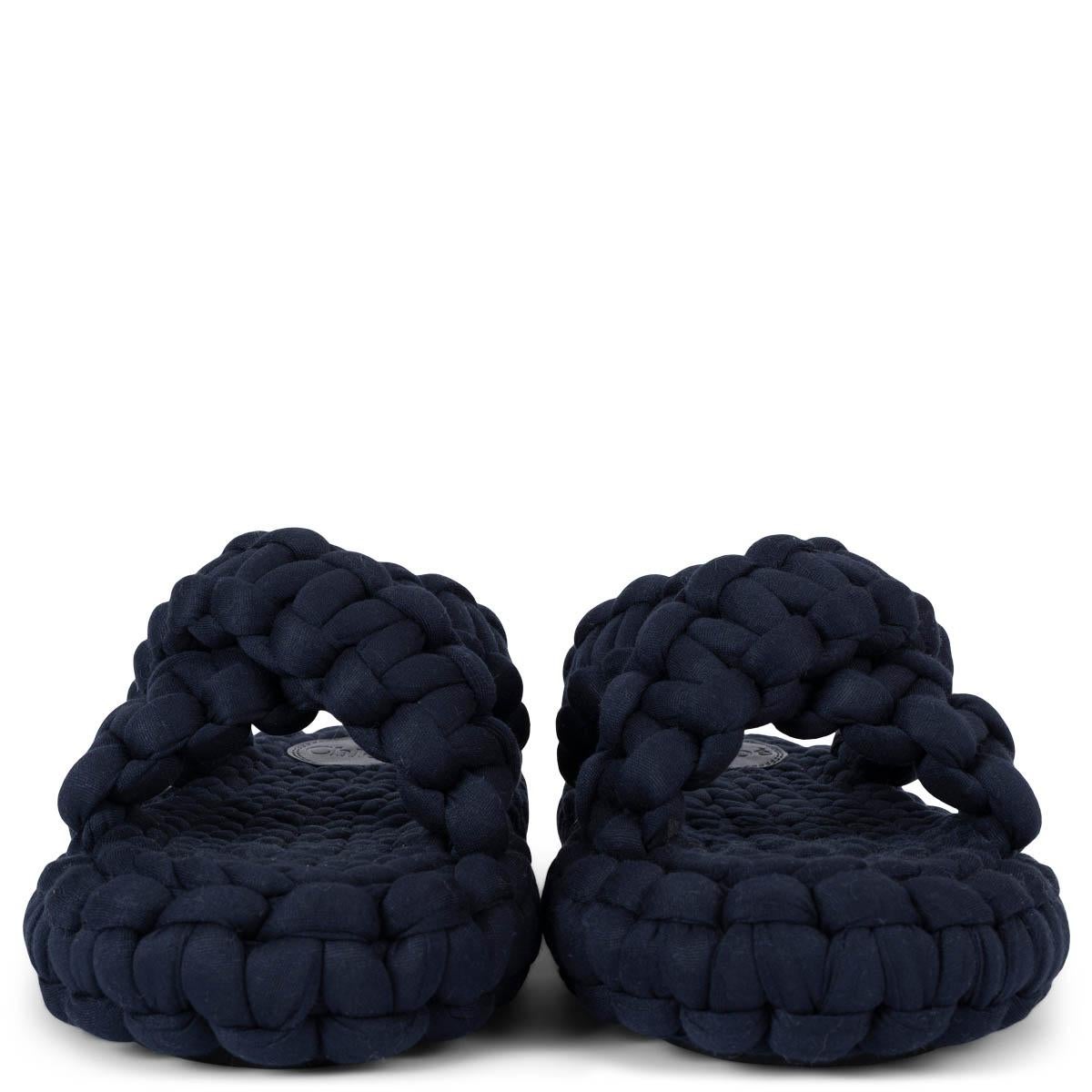 100% authentic Chloé Kamy braided slides are repurposes strips of navy blue leftover jersey. The design features crossover straps and covered platform soles. Brand new. Come with dust bags. 

Measurements
Imprinted Size	37
Shoe Size	37
Inside