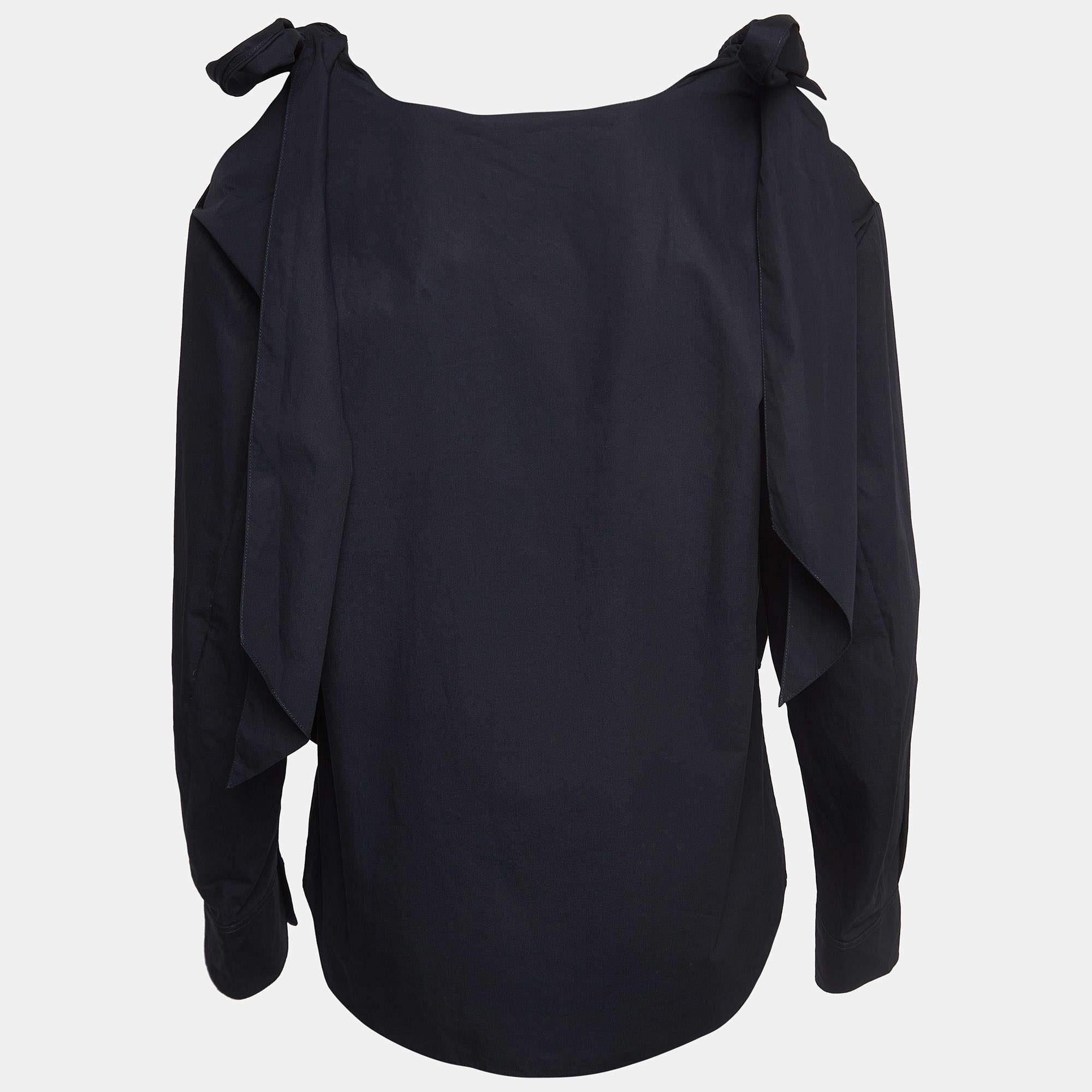 Indulge in elegance with this Chloe blouse. The use of cotton and the addition of cold-shoulder cuts create a timeless piece that redefines sophistication and elevates your fashion quotient.