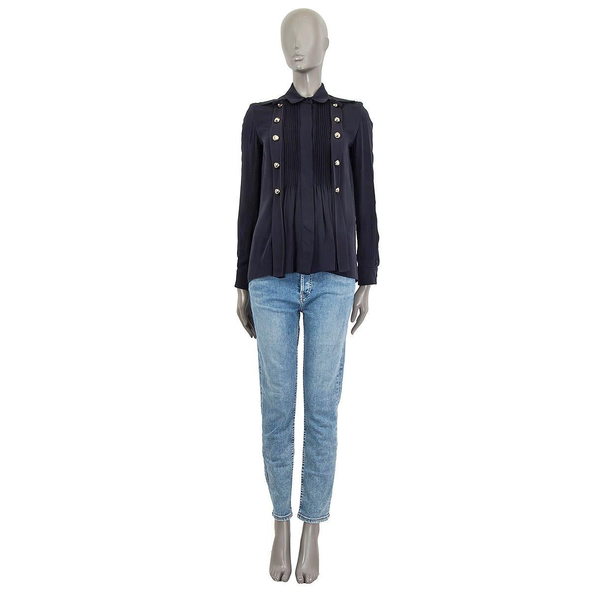100% authentic Chloé oversized paneled long sleeve blouse in navy blue silk (100%). Features two faux button tapes on the front and buttoned cuffs. Opens with eight concealed buttons and a hook on the front. Unlined. Has been worn and is in