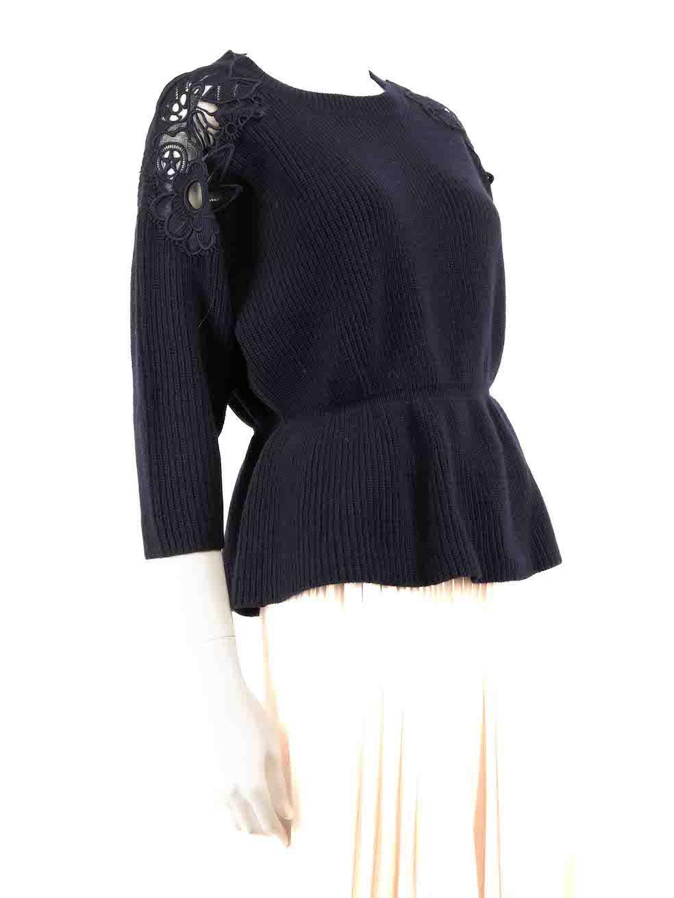 CONDITION is Very good. Hardly any visible wear to jumper is evident on this used Chloé designer resale item.
 
 Details
 Navy
 Wool
 Mid length sweater
 Round neckline
 Knitted and stretchy
 Flower embroidered detail on shoulder
 Elasticated