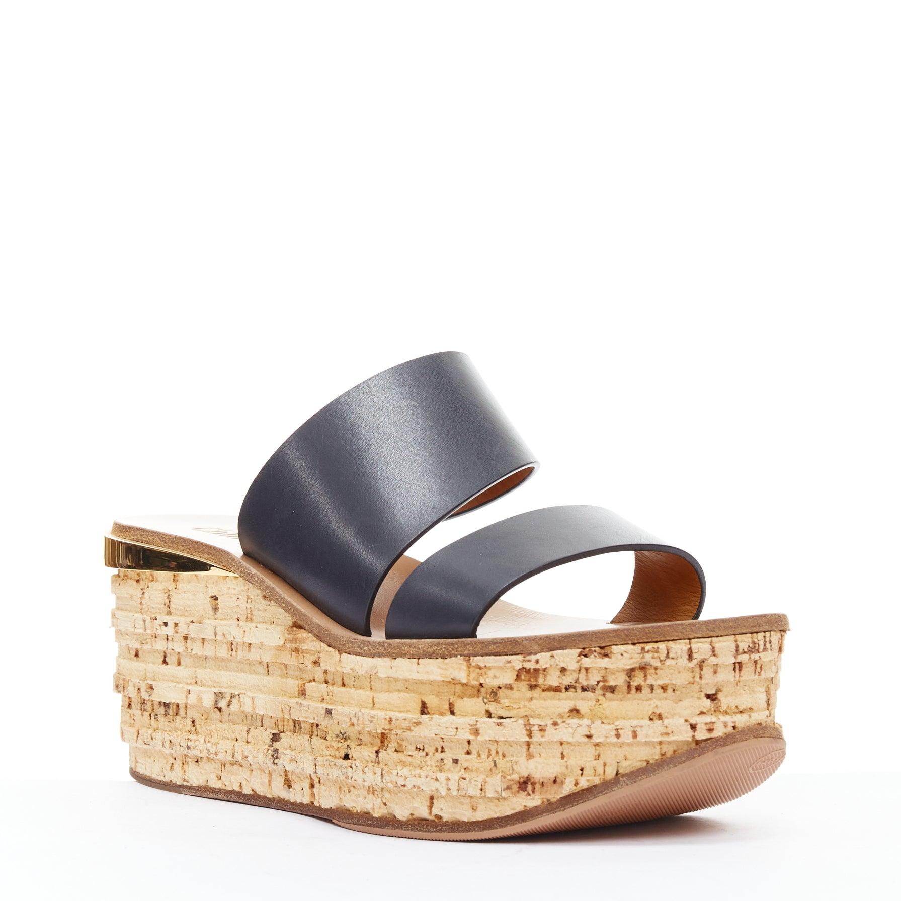 CHLOE navy leather brown cork platform wedge sandals EU37
Reference: NKLL/A00419
Brand: Chloe
Material: Leather, Cork
Color: Navy, Beige
Pattern: Solid
Closure: Slip On
Lining: Nude Leather
Extra Details: Gold detail at heel. Heel height 7cm,