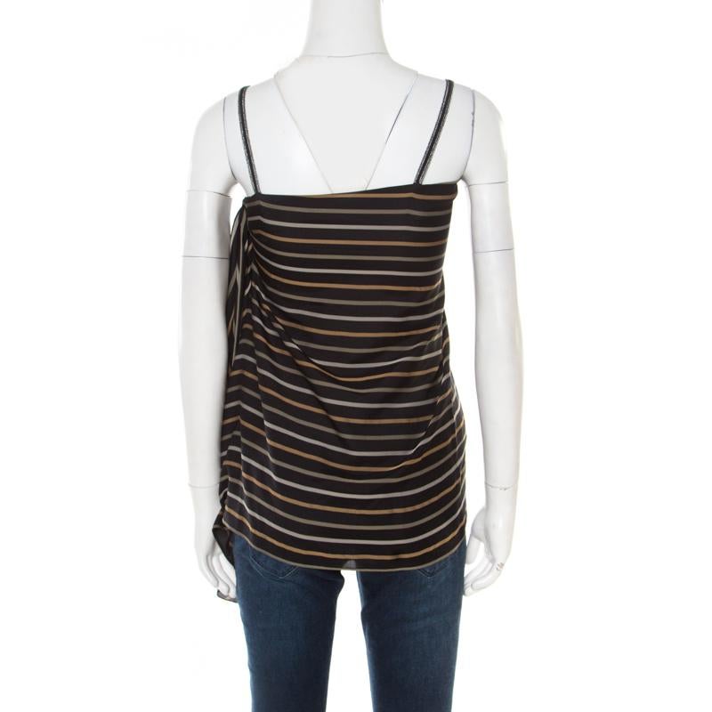 How chic is this Chloe top! The fabulous creation is made of a silk blend and features a striped pattern all over it. It flaunts a flattering silhouette along with an asymmetrical drape detailing and noodle straps. It is sure to lend you a great fit