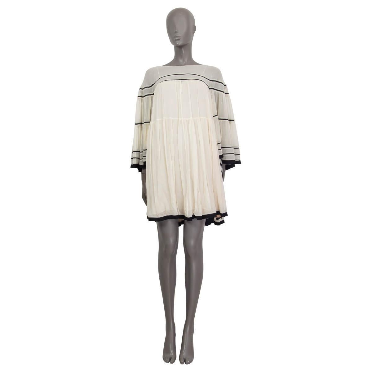100% authentic Chloe striped dress in ivory and black silk (100%). Features a flared fit and flared sleeves. Comes with a nude slip dress in nude silk (100%). Has some faint stains at the sleeves otherwise in excellent condition. 

Measurements
Tag