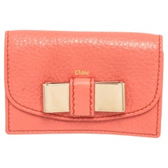 Chloe Orange Leather Bow Card Holder Wallet with gold-tone hardware, leather