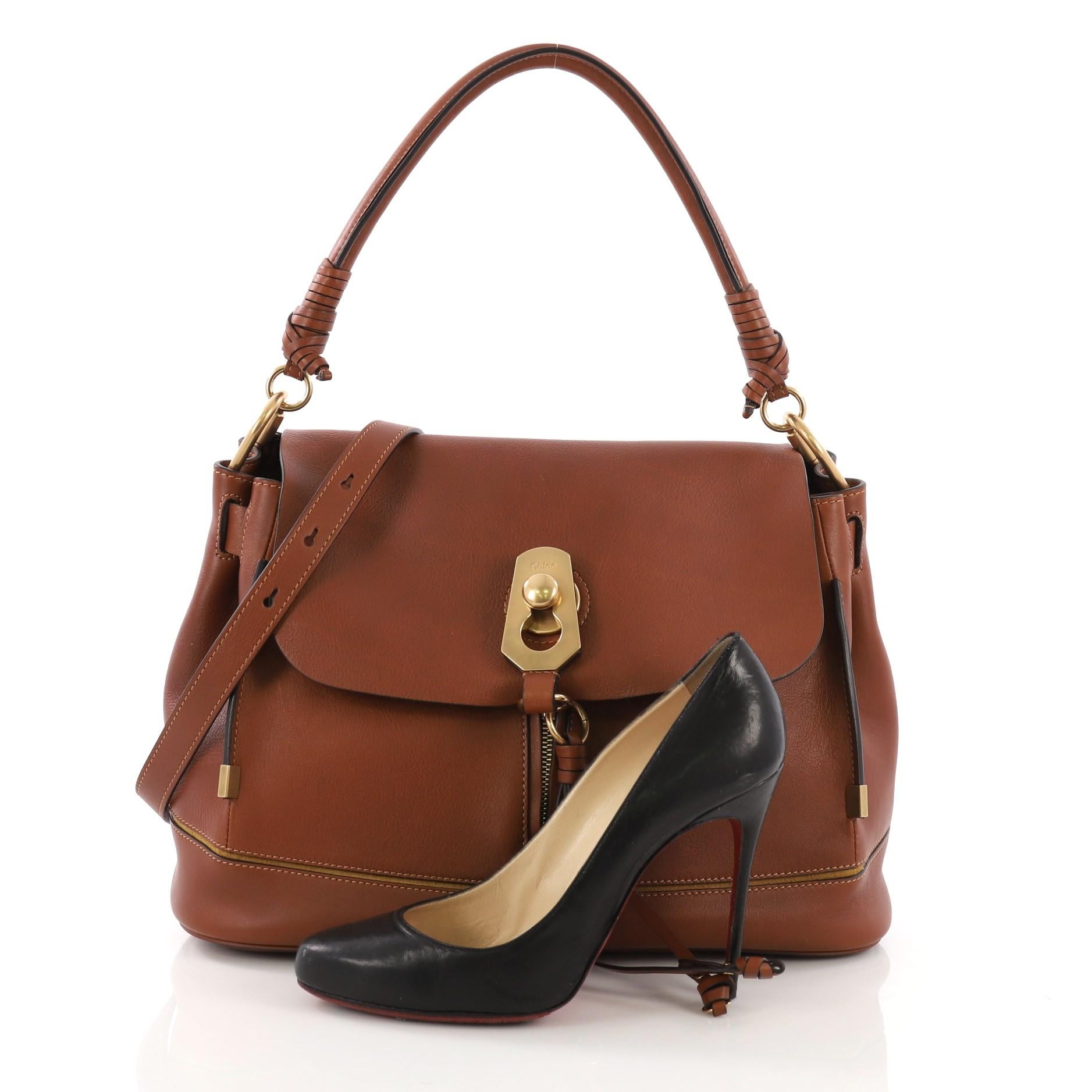 This Chloe Owen Flap Bag Leather Small, crafted in brown leather, features single top leather handle, detachable leather strap, and gold-tone hardware. It opens to a beige fabric interior with zip and slip pockets. **Note: Shoe photographed is used