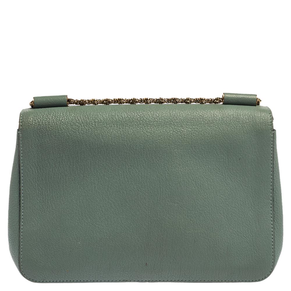 Every curve and detail on this Chloe Elsie is stylish, which adds to the bag's worth. It has been crafted from quality leather and styled with a flap. The pale green-hued bag is secured by a turn-lock revealing a well-sized leather-lined interior