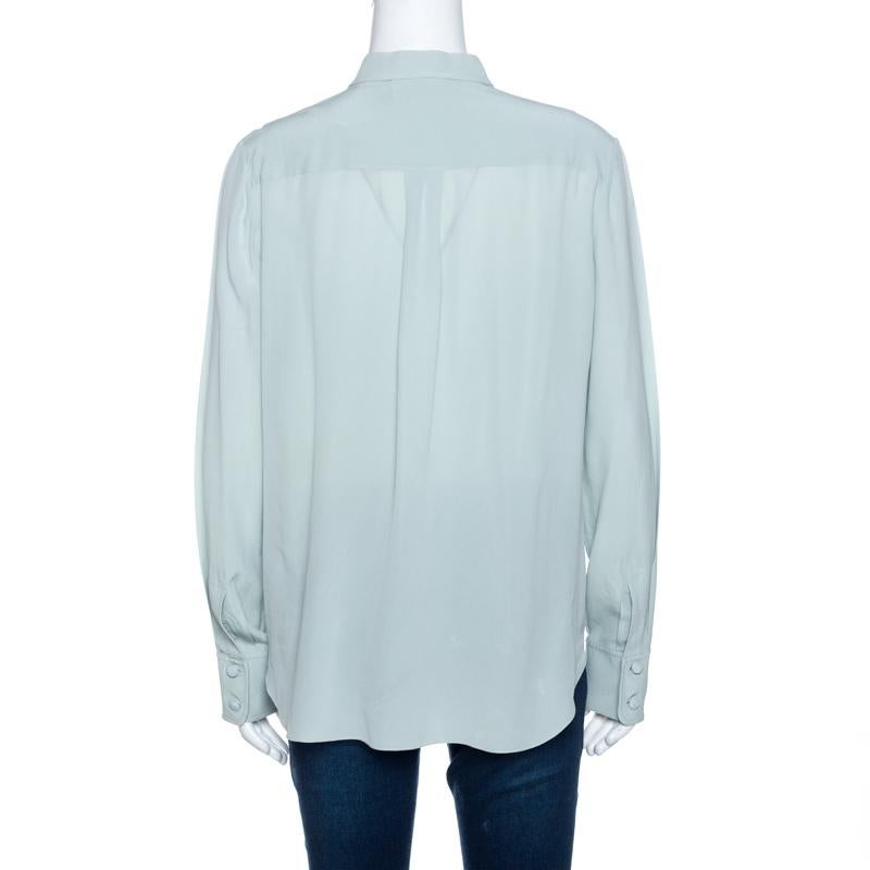 The house of Chloe brings you this fabulous shirt crafted from 100% silk. It comes in a lovely shade of pale green and exudes elegance. It is styled with a simple neckline, button closure, eyelet lace layered to add interest, long sleeves and a