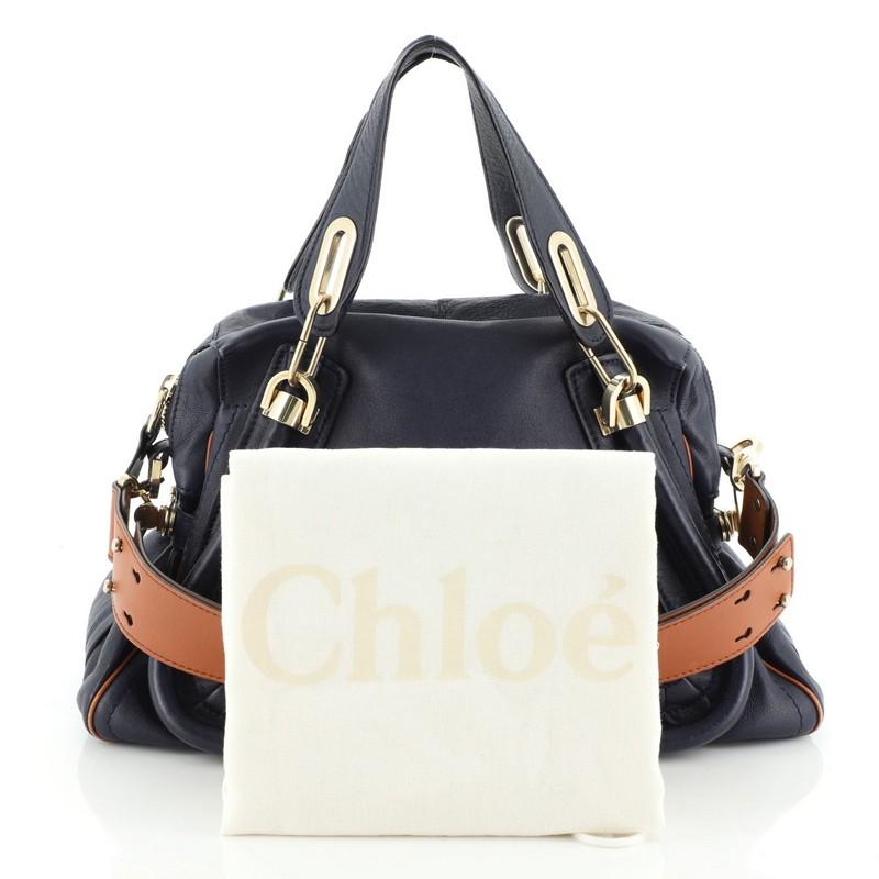 Estimated Retail Price: $2,295
Condition: Good. Moderate wear on base and opening corners, wear, discoloration and creasing on exterior. Cracking on handle and strap wax edges, minor wear in interior, scratches on hardware. 
Accessories: Dust Bag,