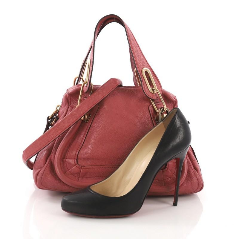 This Chloe Paraty Top Handle Bag Leather Small, crafted in pink leather, features dual flat leather handles, piped trim details, and gold-tone hardware. Its top zip closure opens to a beige fabric interior with zip pocket. **Note: Shoe photographed