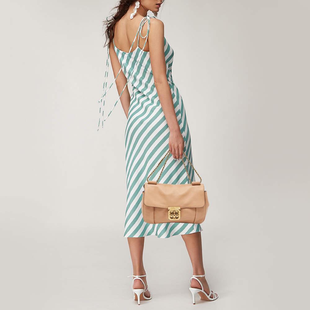 Designer bags are ideal companions for ample occasions Here we have a fashion meets functionality piece crafted with precision. It has been equipped with a well sized interior that can easily fit your small essentials.