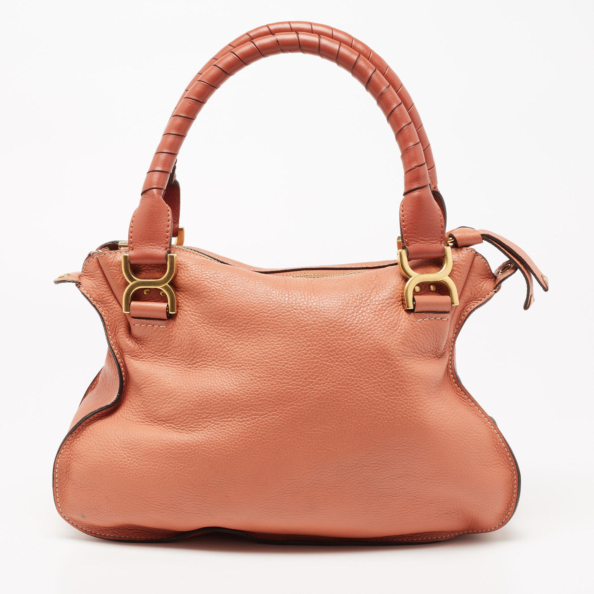 Stunning to look at and durable enough to accompany you wherever you go, this Chloe shoulder bag is a joy to own! This Marcie bag is crafted from leather with dual handles and a well-designed front exterior enhanced with stitch detailing and