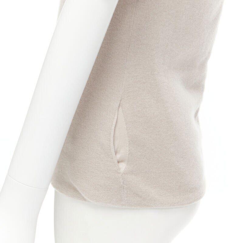 CHLOE Perle beige cashmere silk gold zip back short sleeve sweater S
Reference: MELK/A00048
Brand: Chloe
Model: 11SMP04-11S500
Material: Cashmere, Silk
Color: Beige
Pattern: Solid
Closure: Zip
Extra Details: Dual side seam pockets. Gold-tone zip